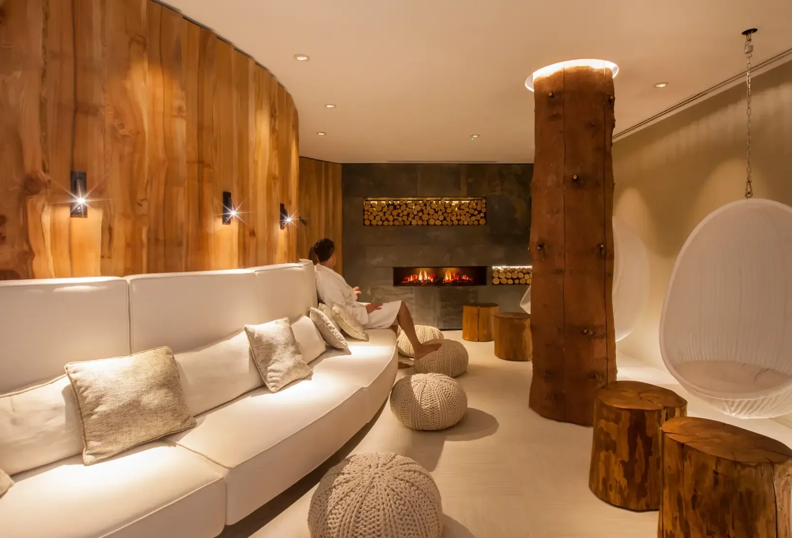Social relaxation space with fireplace and natural timber at Champneys Forest Mere