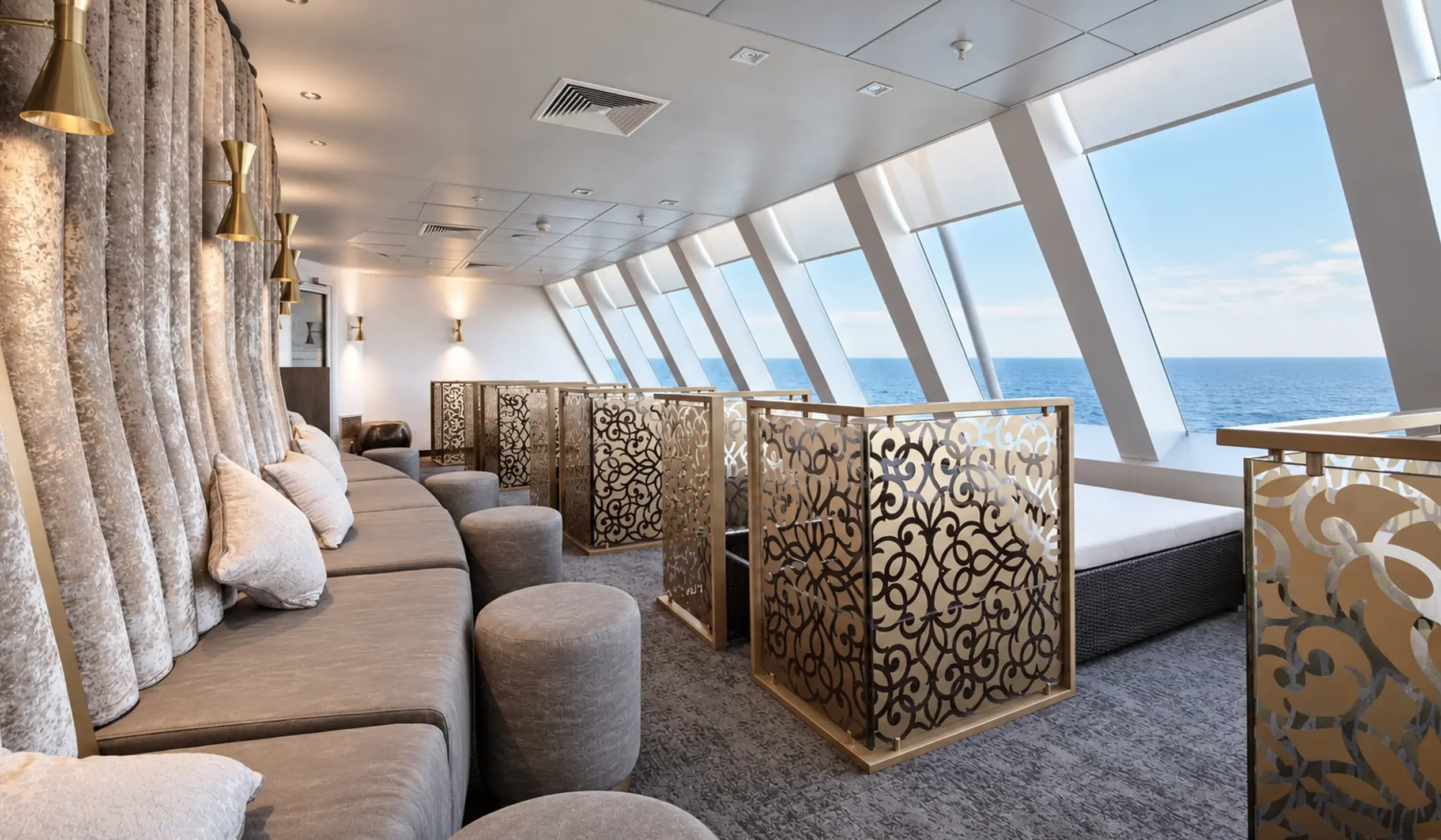 Deep relaxation room with bespoke decorative screens creating private single and double relaxation spaces.