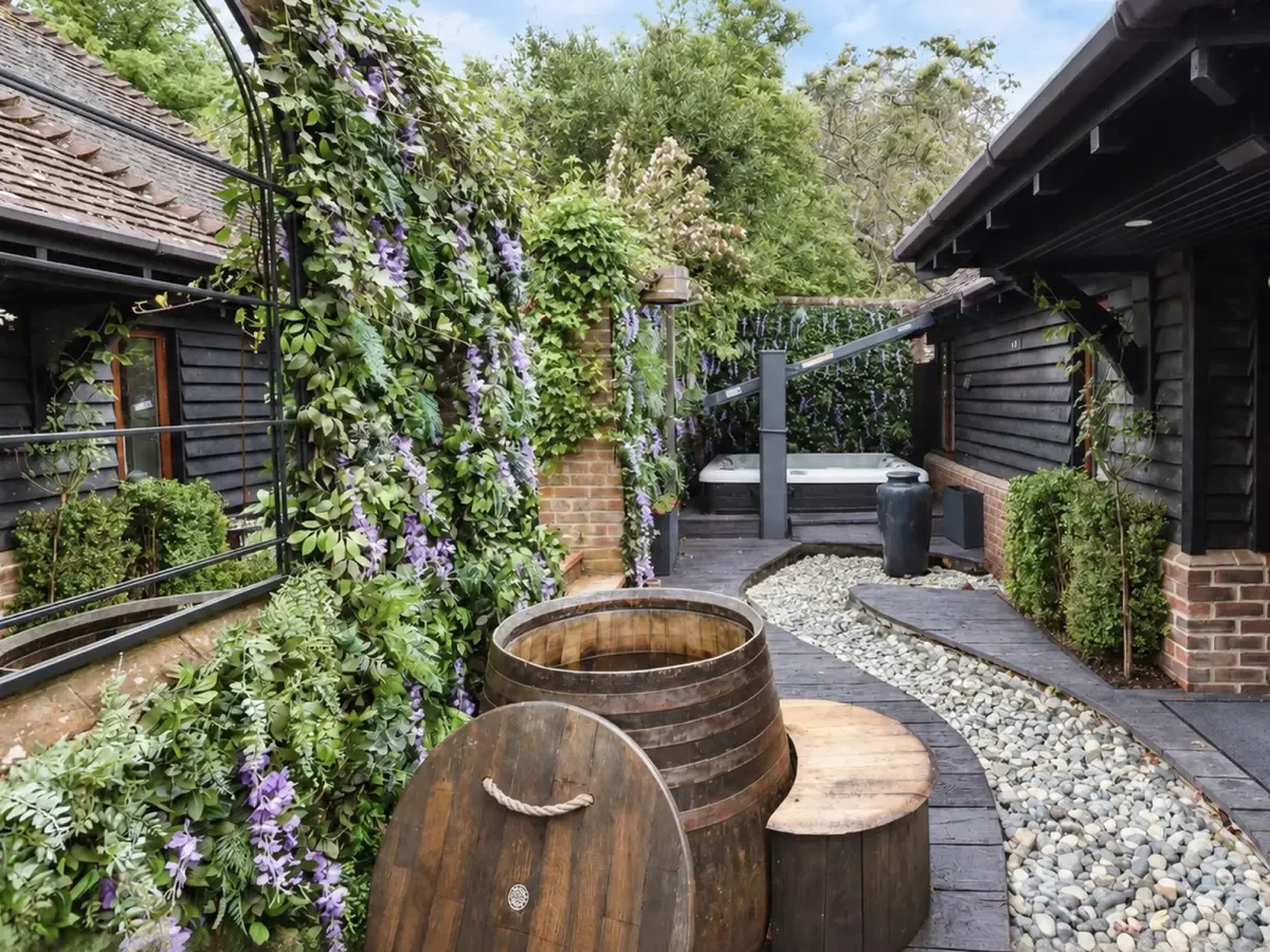 Landscaped wellness garden at Quob Park with natural planting and outdoor relaxation spaces.