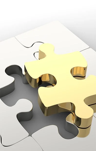 the last puzzle piece fitting into other puzzle pieces