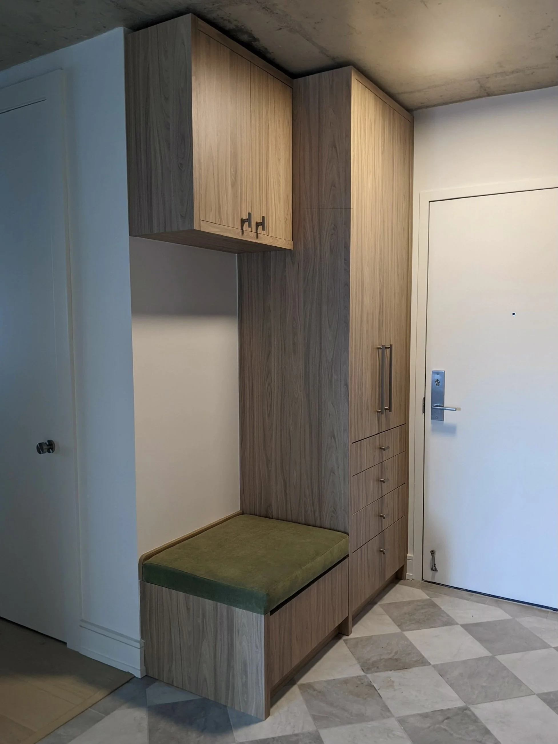 The entry cabinet has two deep drawers for storing shoes and green velvet upholstered seat 