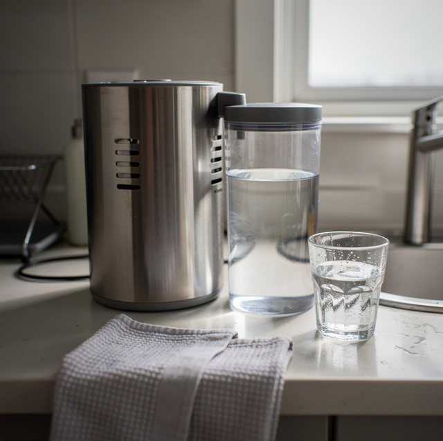 clear water dripping into glass distillation flask
