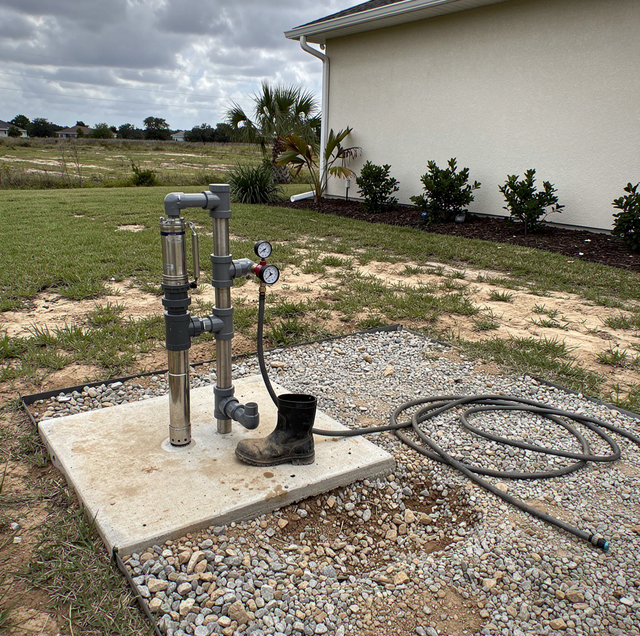Deep water well drilling rig extracting hidden groundwater