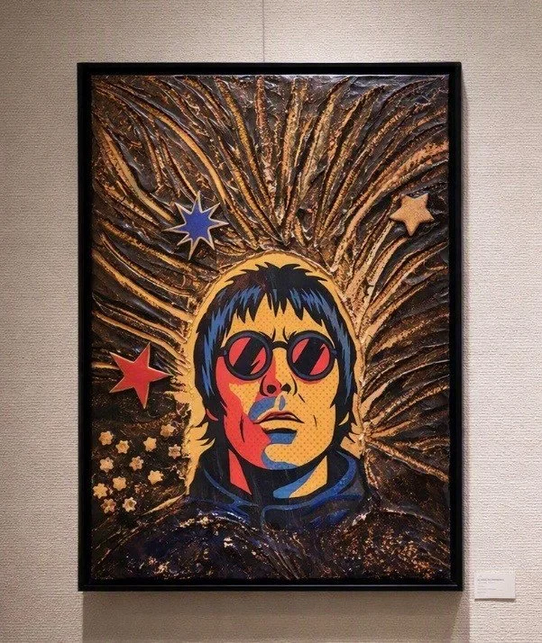 A colorful pop art portrait of a person wearing round sunglasses, with a background of stars and radiating lines.
