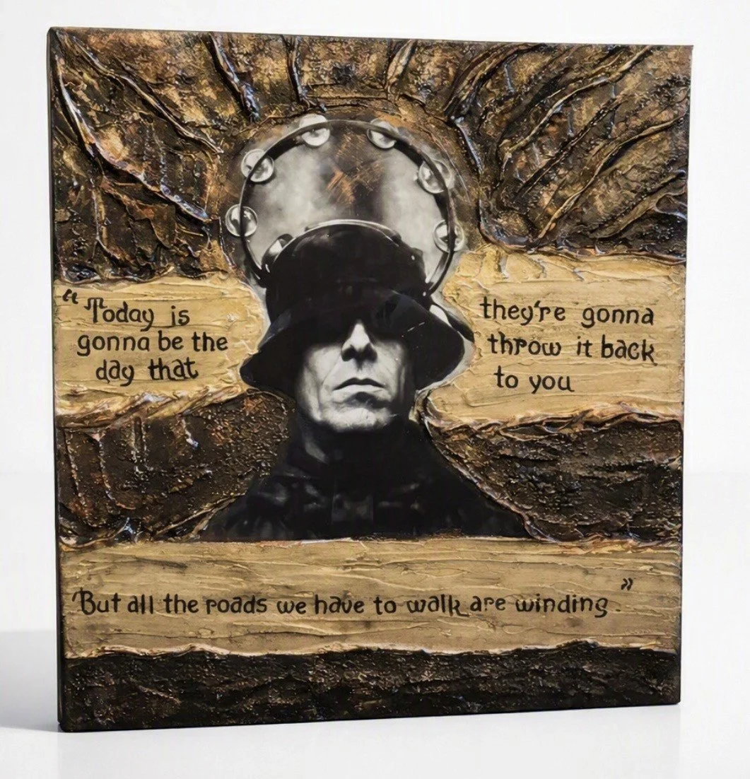Mixed media artwork featuring a portrait of a woman in black, wearing a buffalo nickel on her head, with a textured background and handwritten quote.