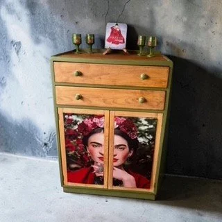 Gorgeous tall boy painted in a leafy green reflecting the typical Frida Kahlo monstera vibe. Friday Kahlo silk scarf covered inserts to the 2 cupboard doors. Spacious tall boy perfect for bedrooms or any space in your house that deserves an iconic pe