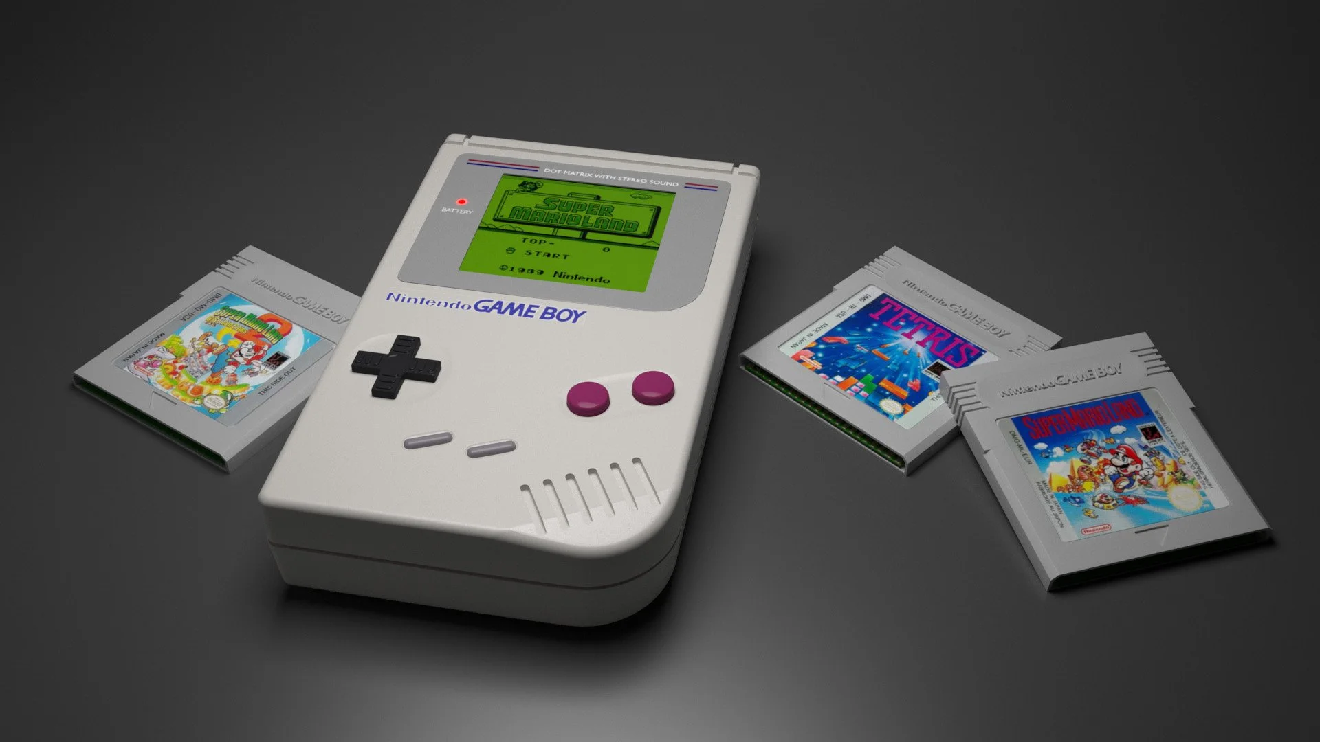 A vintage Nintendo Game Boy with two game cartridges, Super Mario Land and Tetris, on a dark surface.