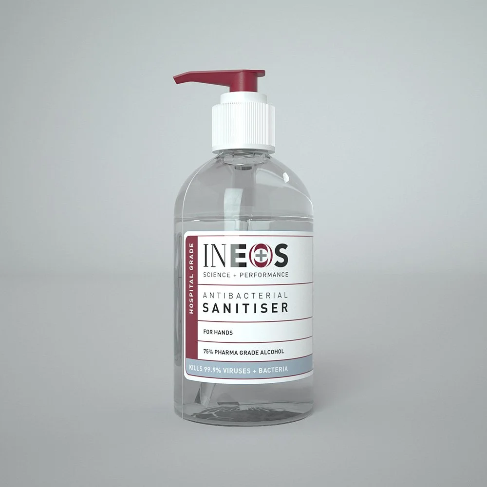 A clear plastic bottle of antibacterial hand sanitizer with a red pump, labeled 'INES Science + Performance Hospital Grade Antibacterial Sanitiser, For Hands, 75% Pharma Grade Alcohol, Kills 99.9% Viruses + Bacteria'.