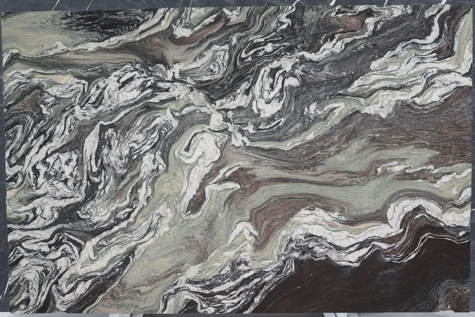 Polished multicolor stone slab showing natural veining from G STONE's material range