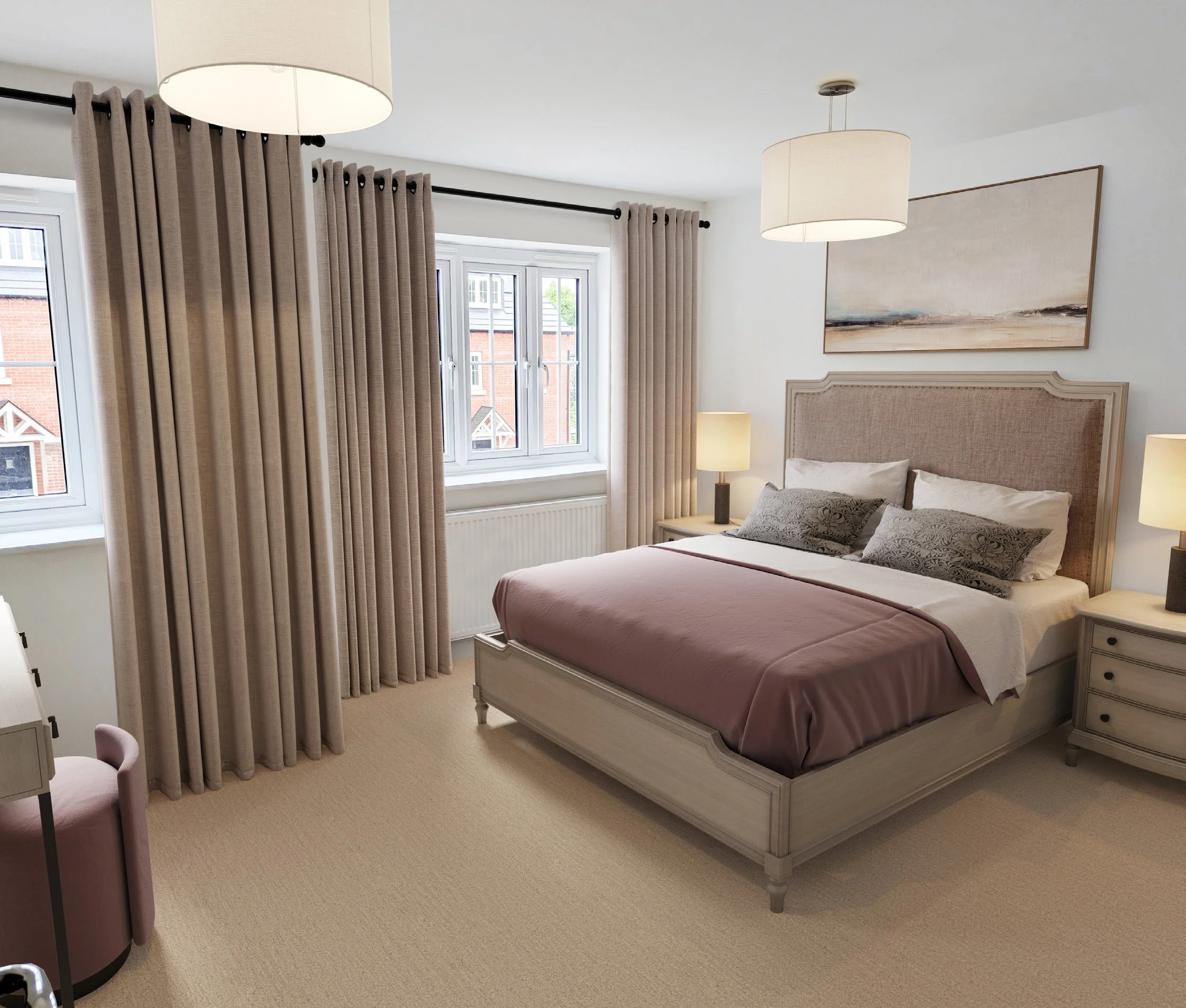 A bedroom with beige curtains, a window, a bed with a beige headboard, a pink bedspread, and gray pillows. There are two pendant lights on the ceiling and a table with a lamp and a piece of artwork hanging on the wall.