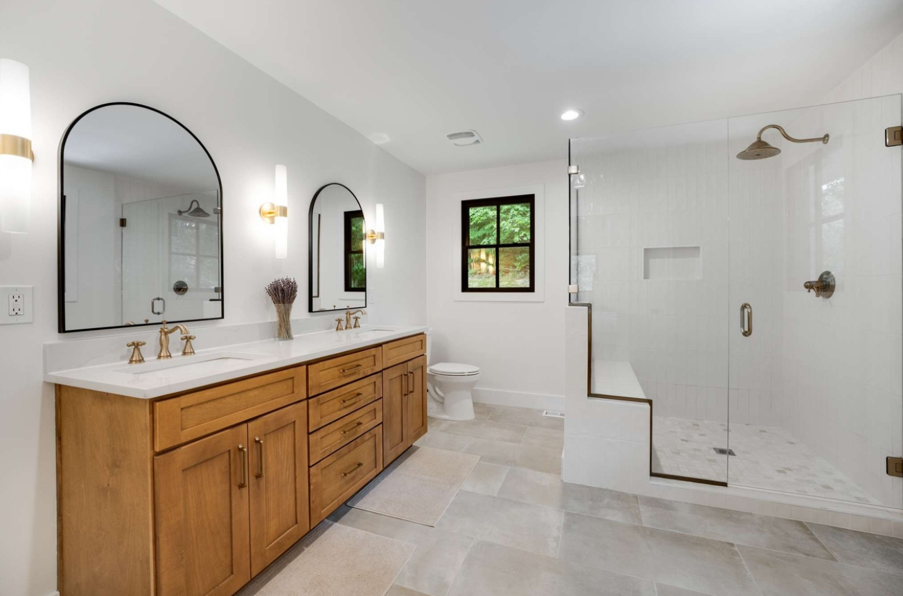 Custom bathroom remodel with wood double vanity, glass walk-in shower, rainhead, new window