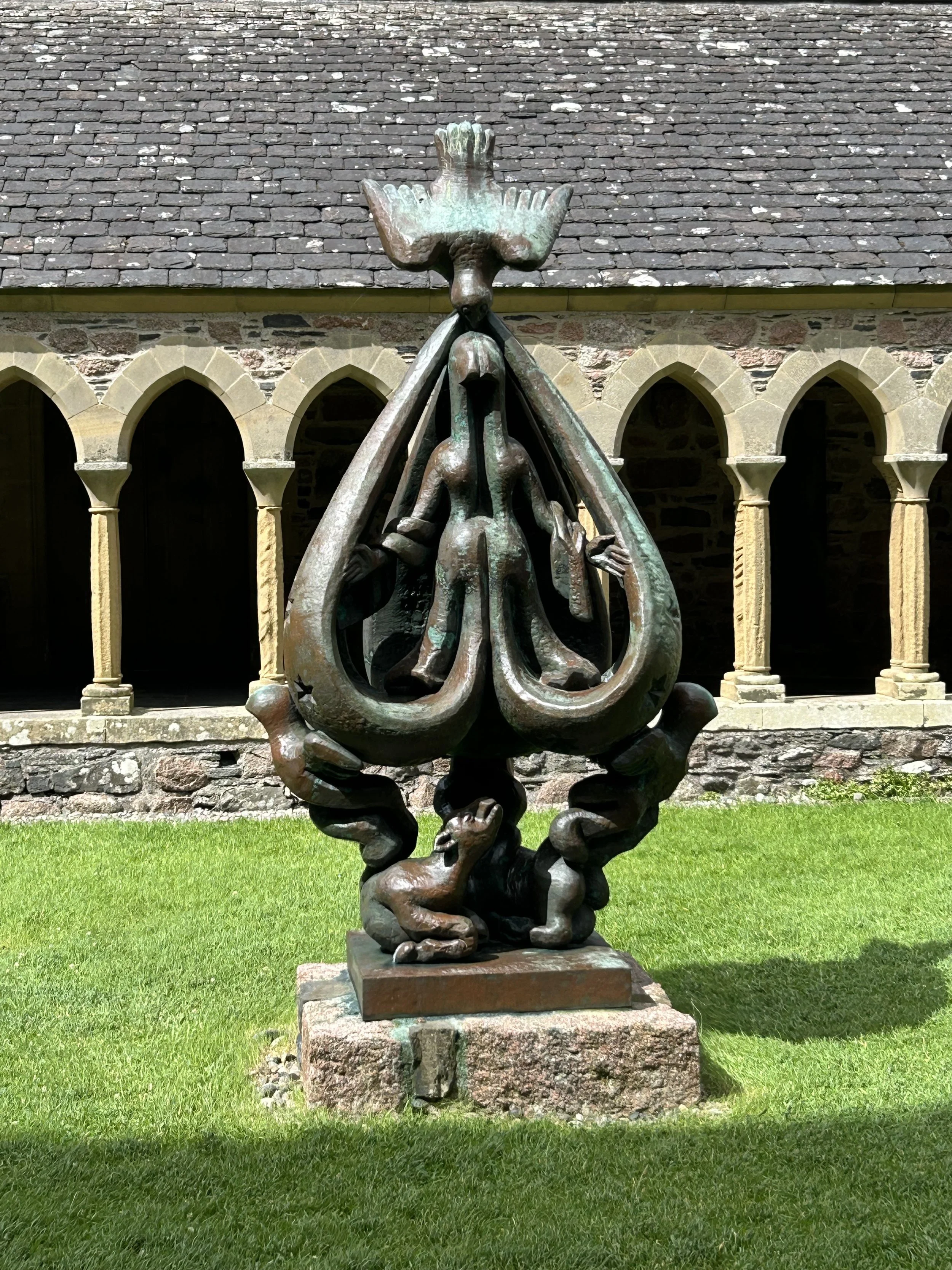 Iona, Scotland: The Abbey and the bronze sculpture, called The Descent of the Spirit, of the Virgin Marysupported by 3 angels as the Holy Spirit surrounds and fills her.
