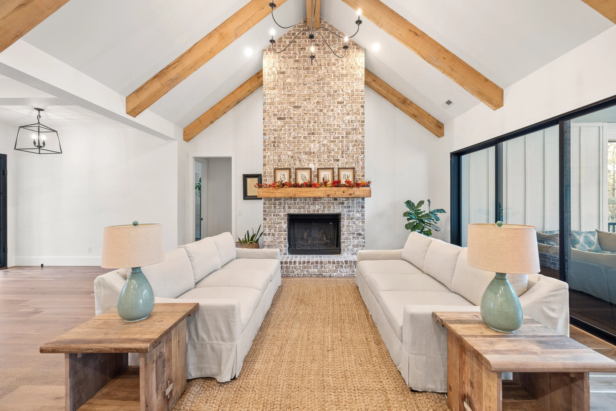 8x8 solid white oak decorative beams. brick fireplace with custom mantel and brick hearth.