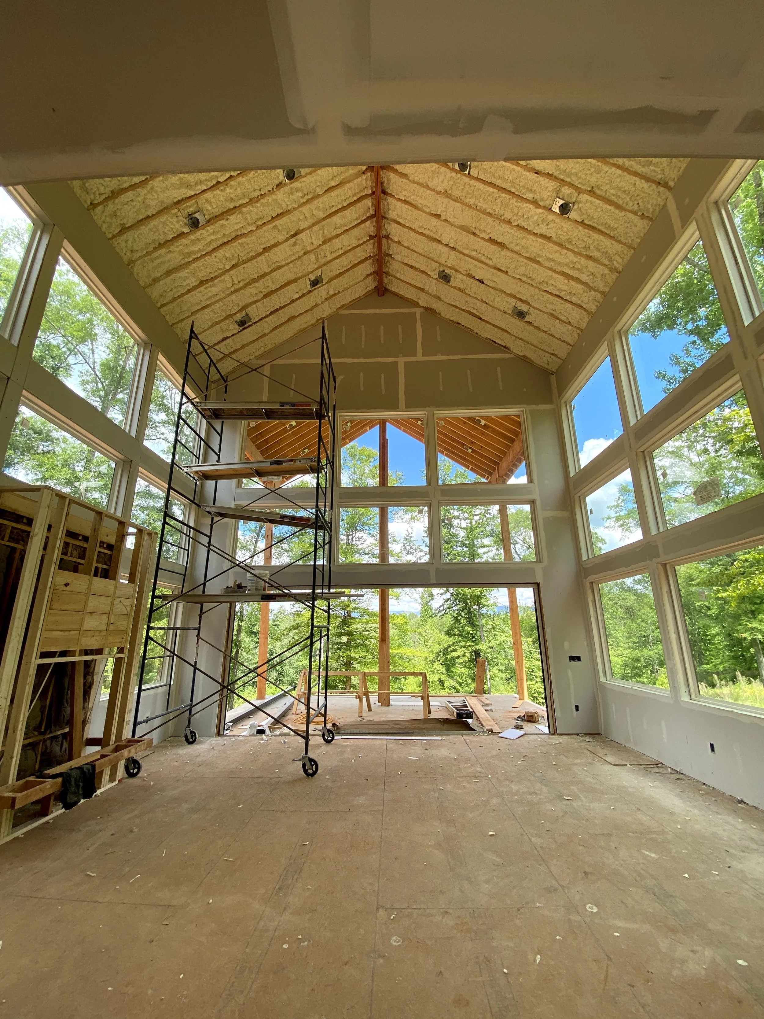 Spray foam insulation sprayed on all of roof deck. Sheetrock installed.
