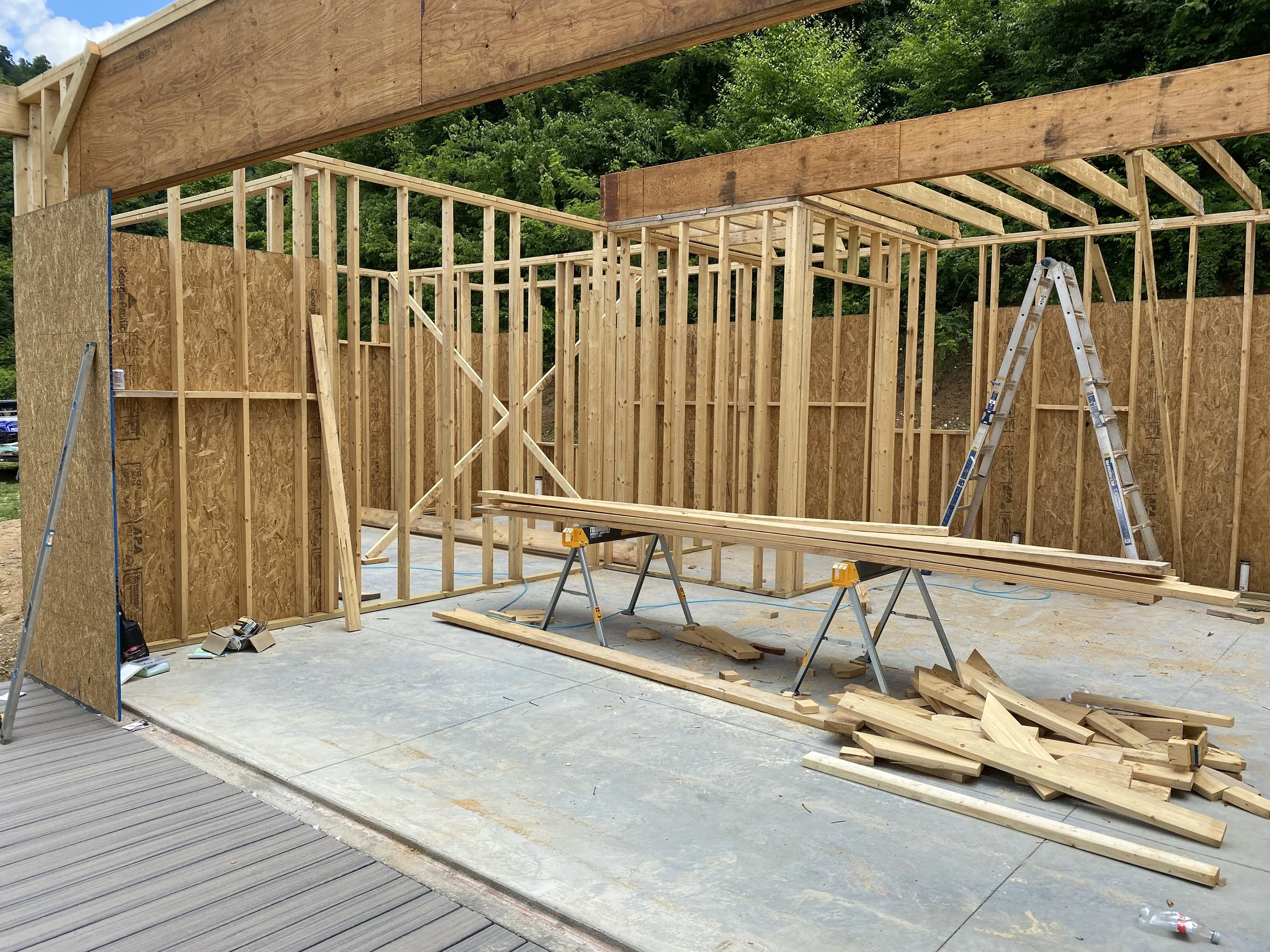 Deck complete with Rocky Slope Trex Enhance Naturals composite decking with Trex hidden fasteners. More interior wall framing.