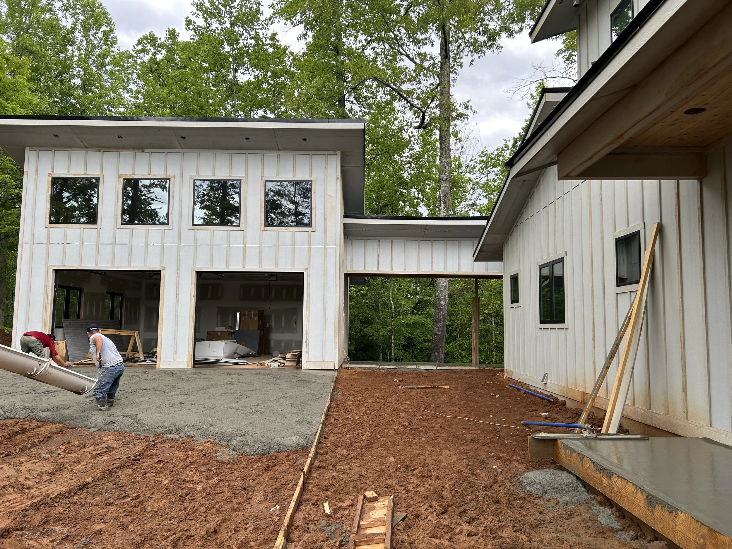 Fiber cement board and baton siding. Detached garage with breezeway to house.
