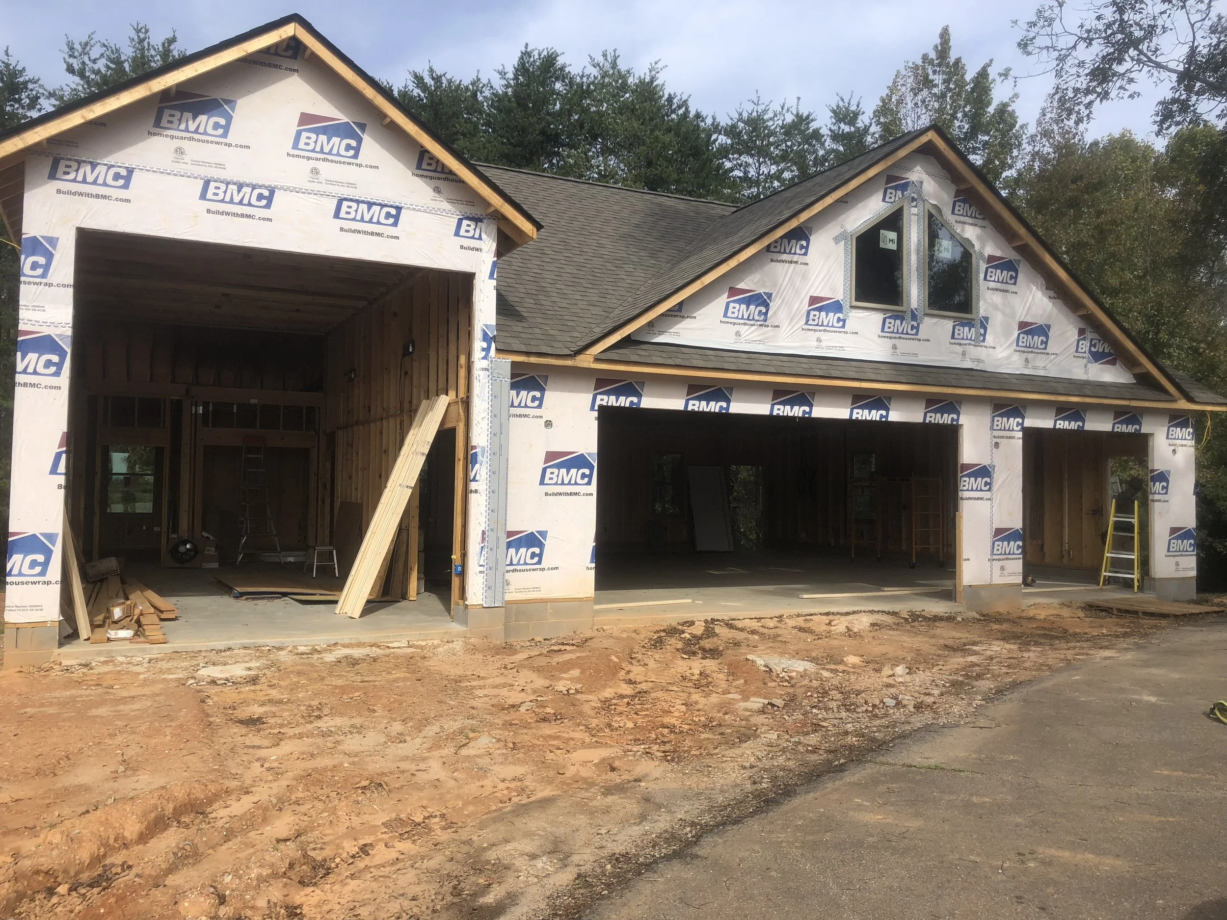 Large detached garage with full shop, bathroom, and RV or auto lift bay.