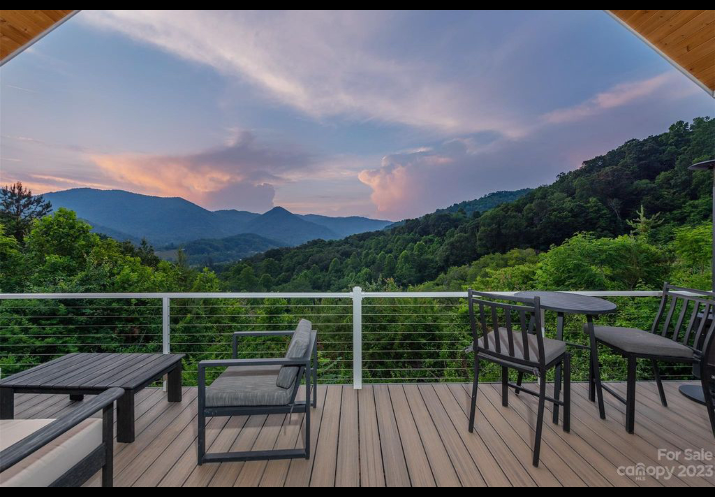 Finished front porch deck. Extruded aluminum handrail with cable railing. Trex Enhanced Naturals decking installed with Trex hidden fasteners.