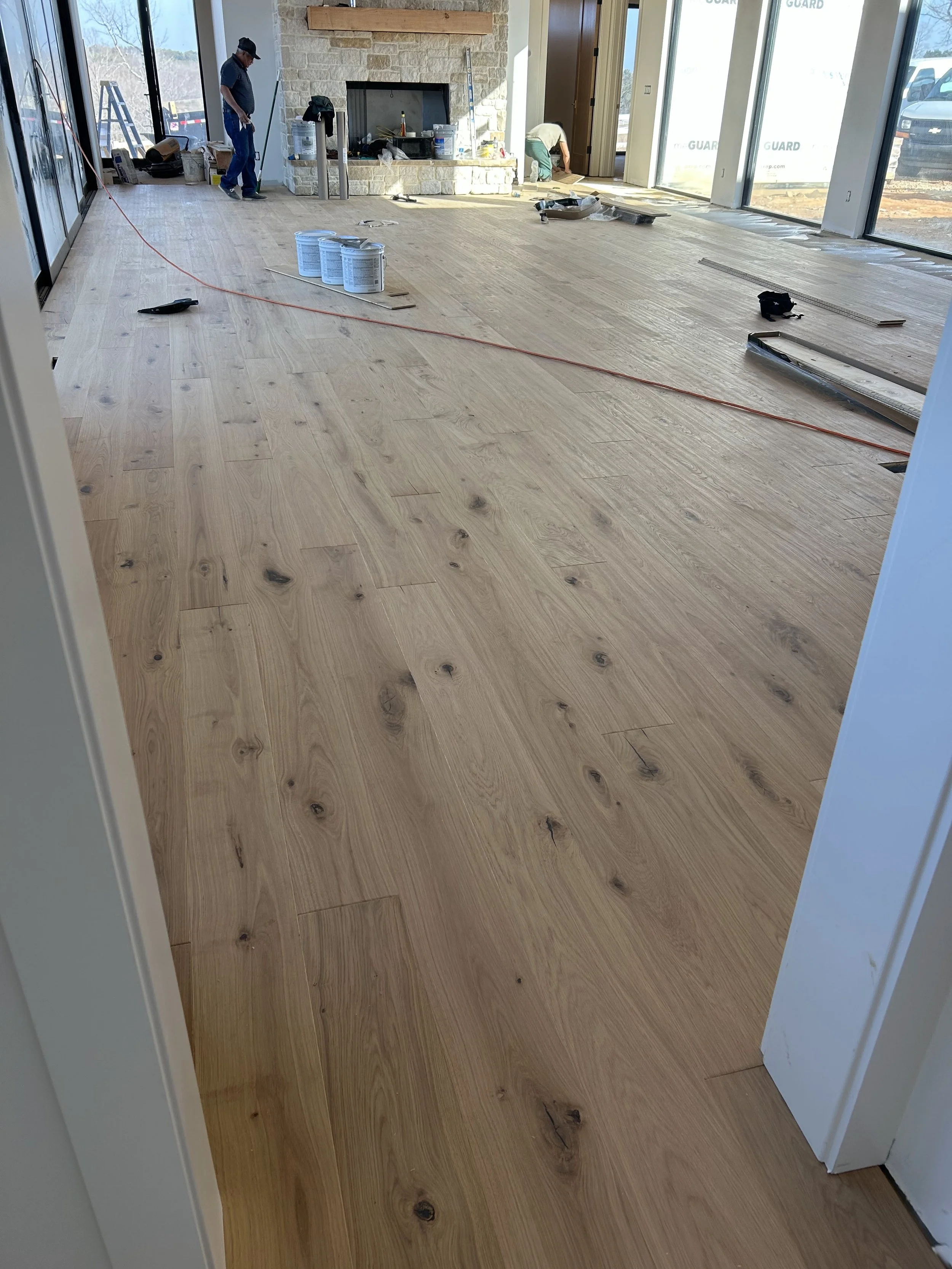 8" wide engineered glue down white oak flooring.