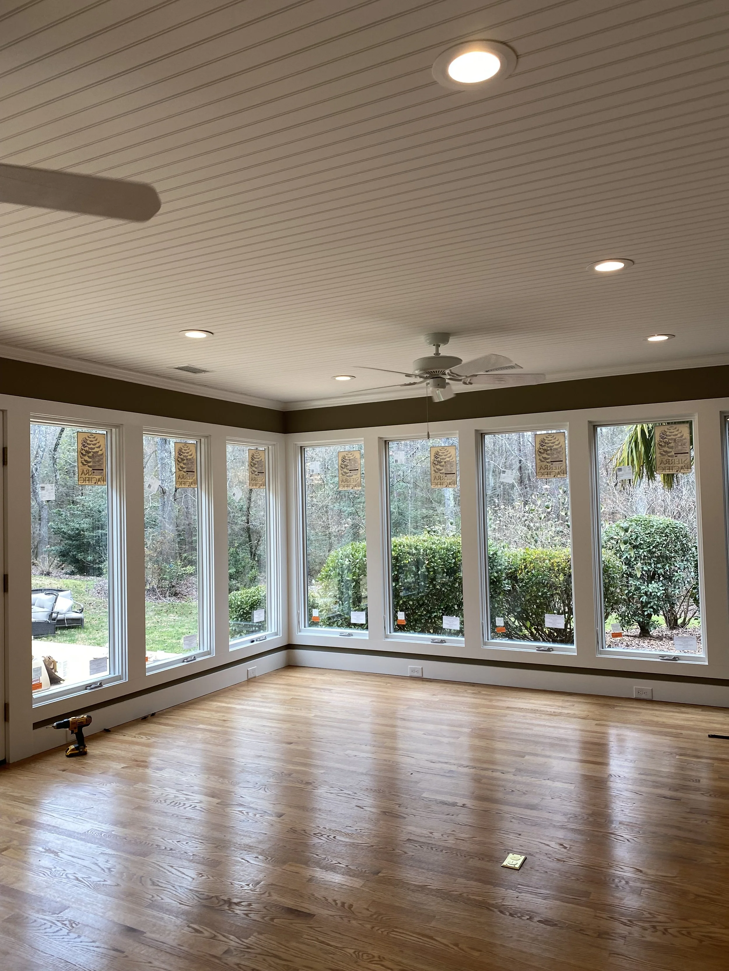 Sun room addition with aluminum clad windows, pine tongue and groove ceilings, and hardwood floors.