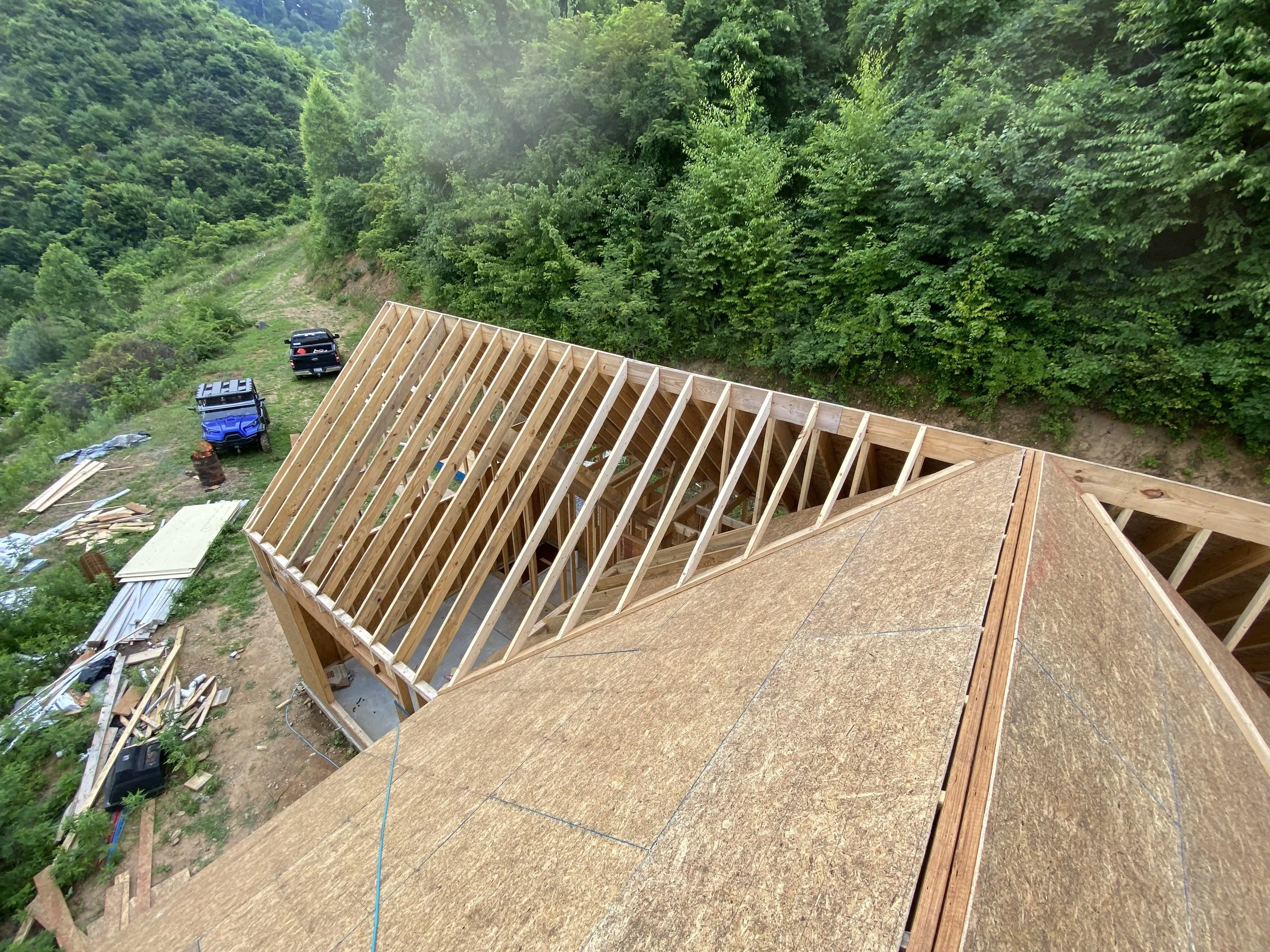Roof framing complete, and roof sheeting has begun. 