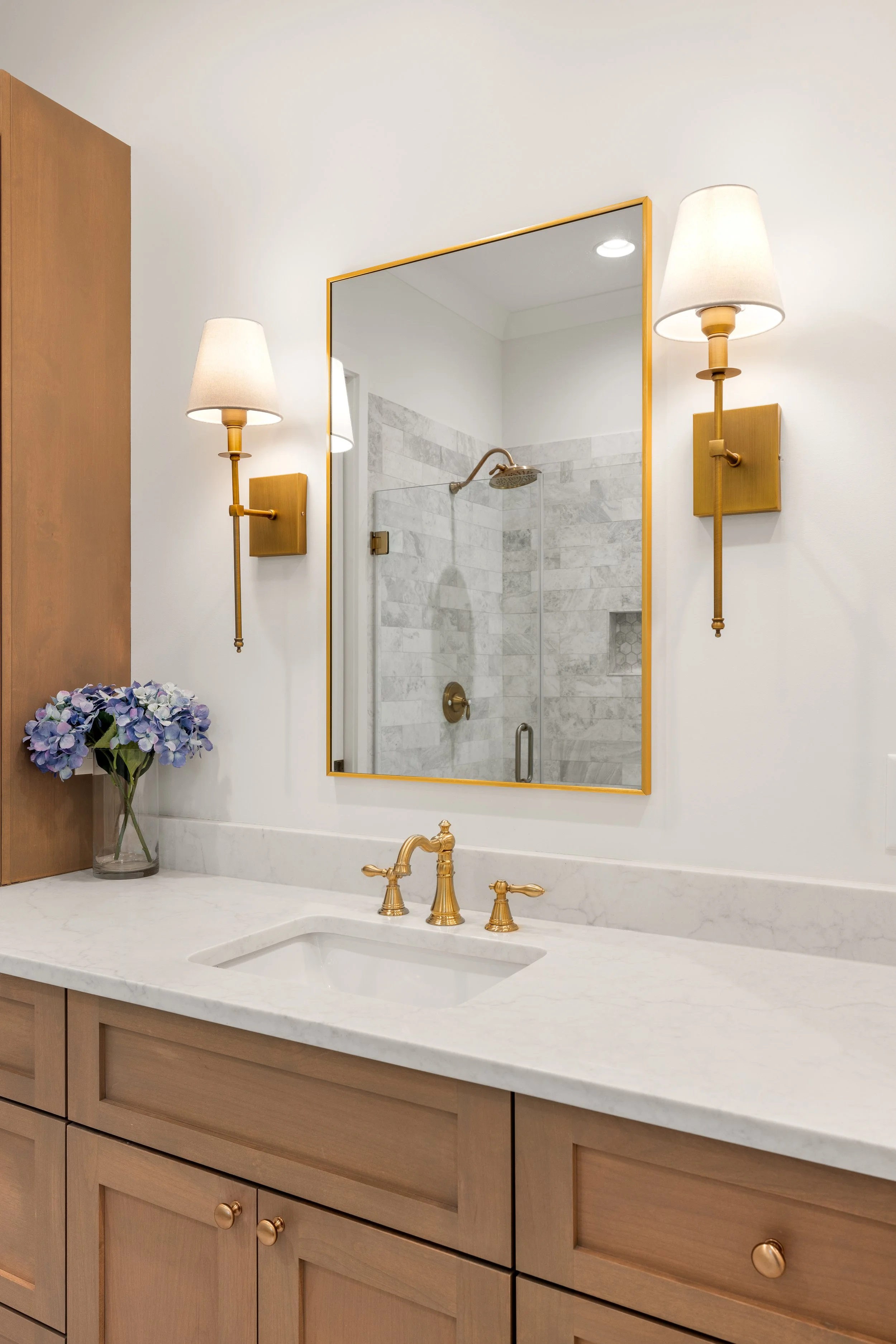 Custom built vanities with quartz counters.