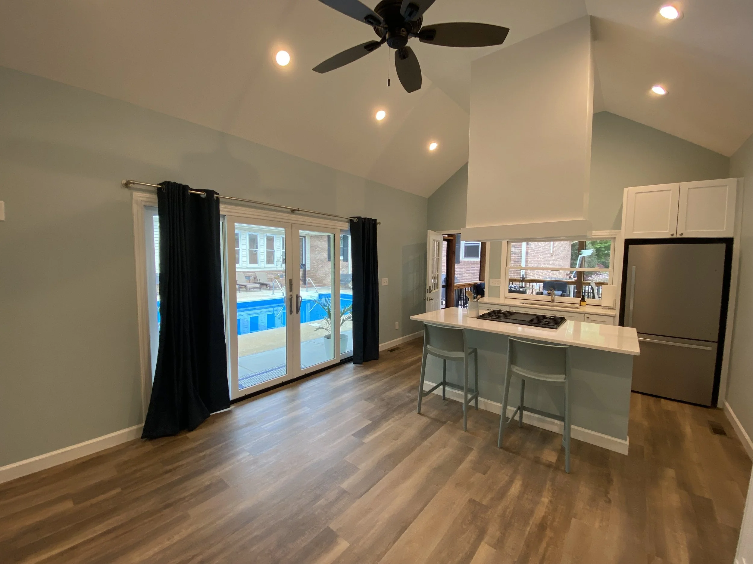 Detached pool house or mother-in-law suite. LVP flooring. Semi custom cabinets with Quartz counter tops.