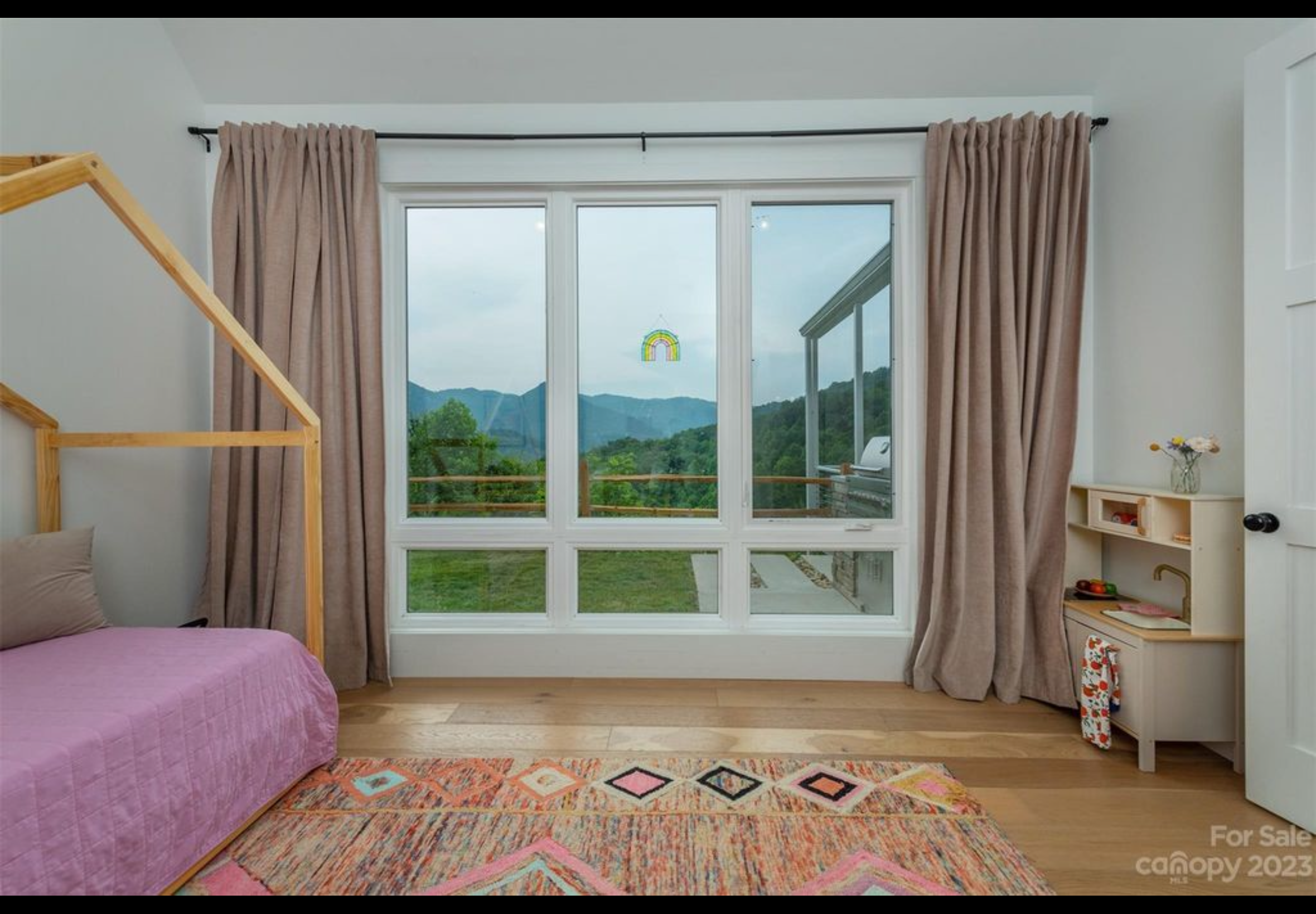 Bedroom two of two bedroom two bath tiny home mountain getaway. Vaulted ceiling. Vinyl casement windows with lower fixed transoms. LVP engineered hardwood flooring with real wood top layer. 8' solid core wood interior doors.