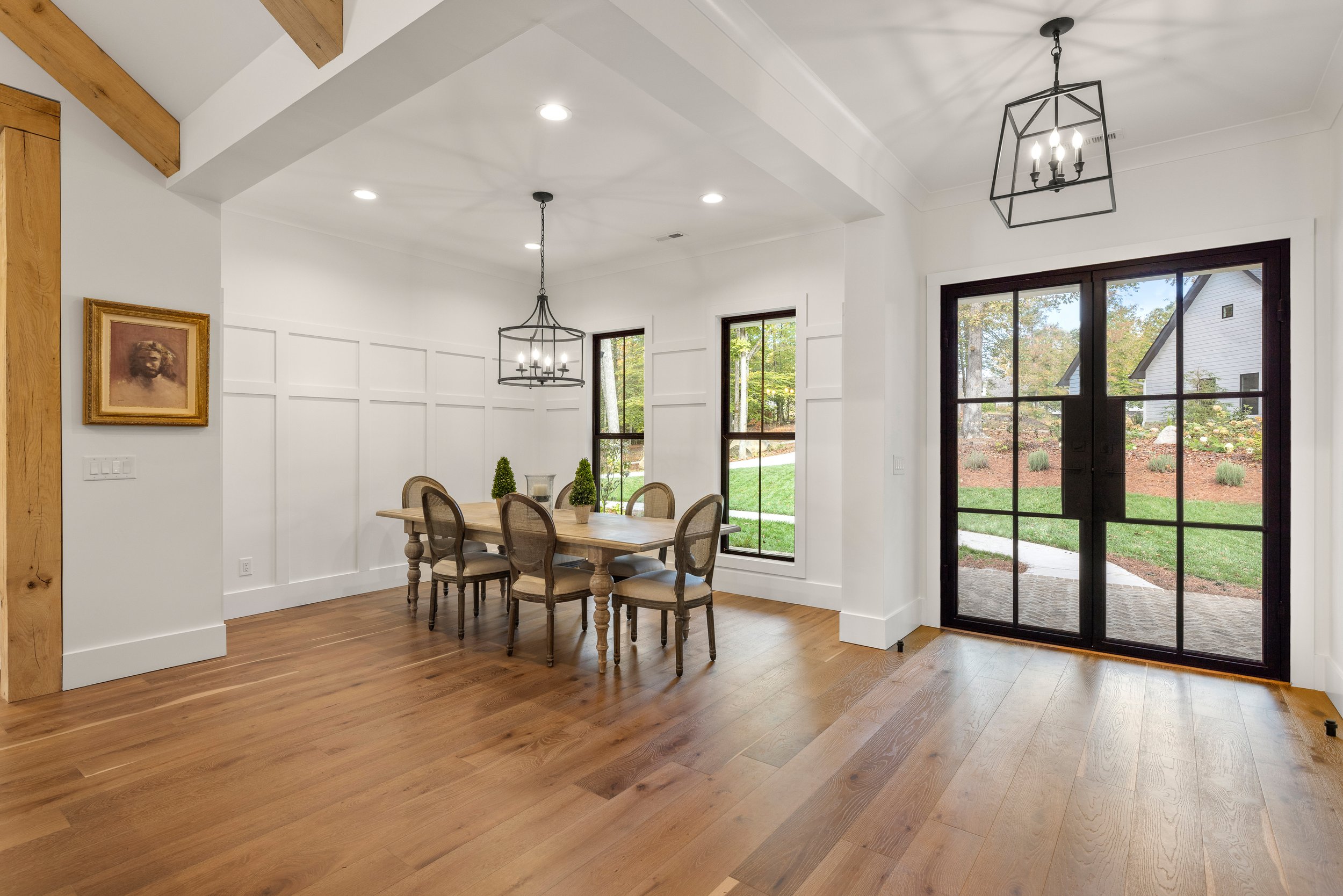 Custom wainscoting and Black Diamond iron entry door.