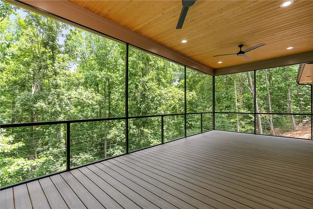 1x6 cedar tongue and groove porch ceiling. Rocky Slope Trex Enhance Naturals composite decking installed with Trex hidden fasteners. Extruded aluminum screen wall with cable rail.