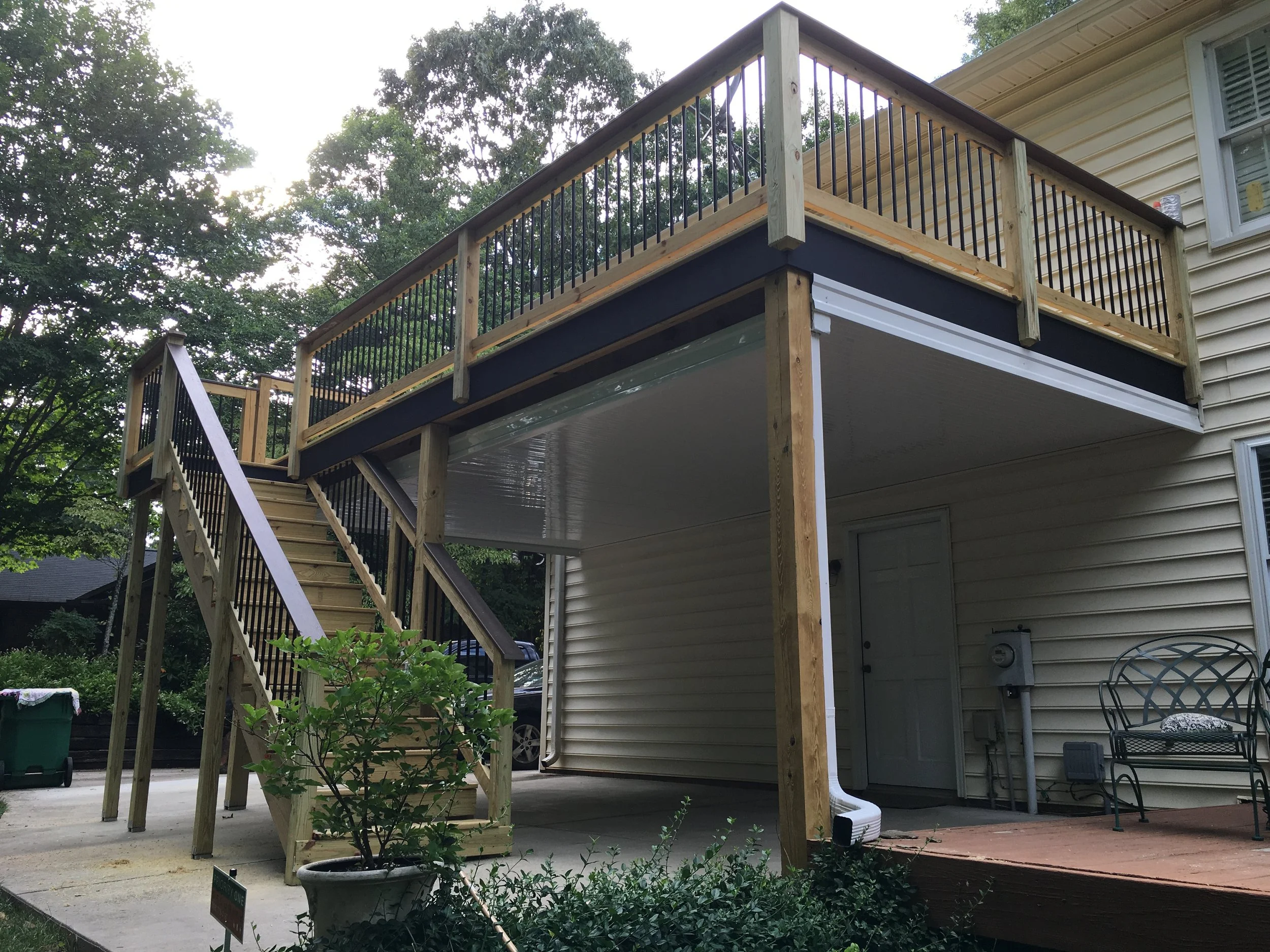 Aluminum under deck gutter pan system for keeping things dry under a deck.