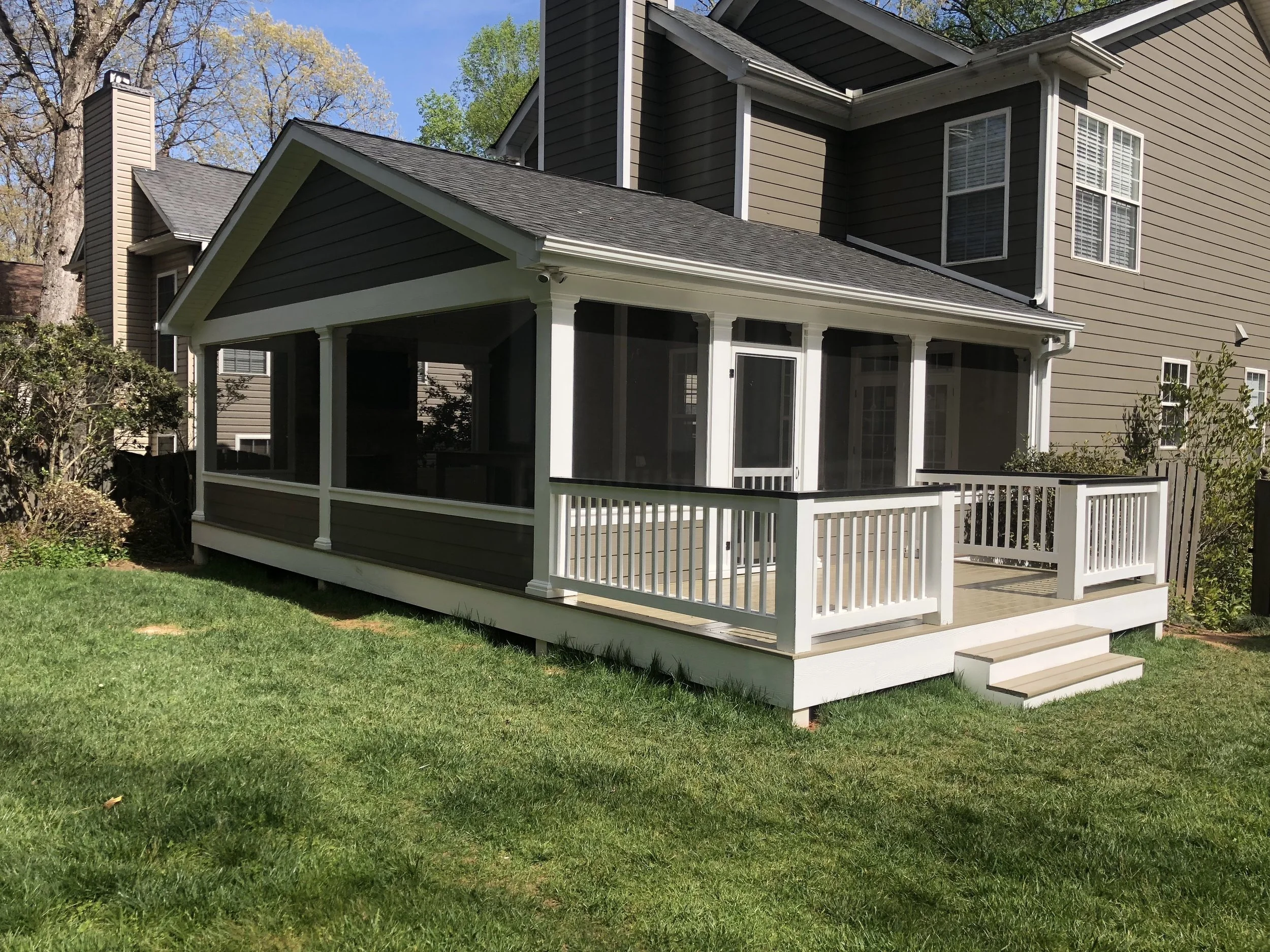 Painted wood decking boards. Painted wooden handrails. Screen-Eze screen wall system.