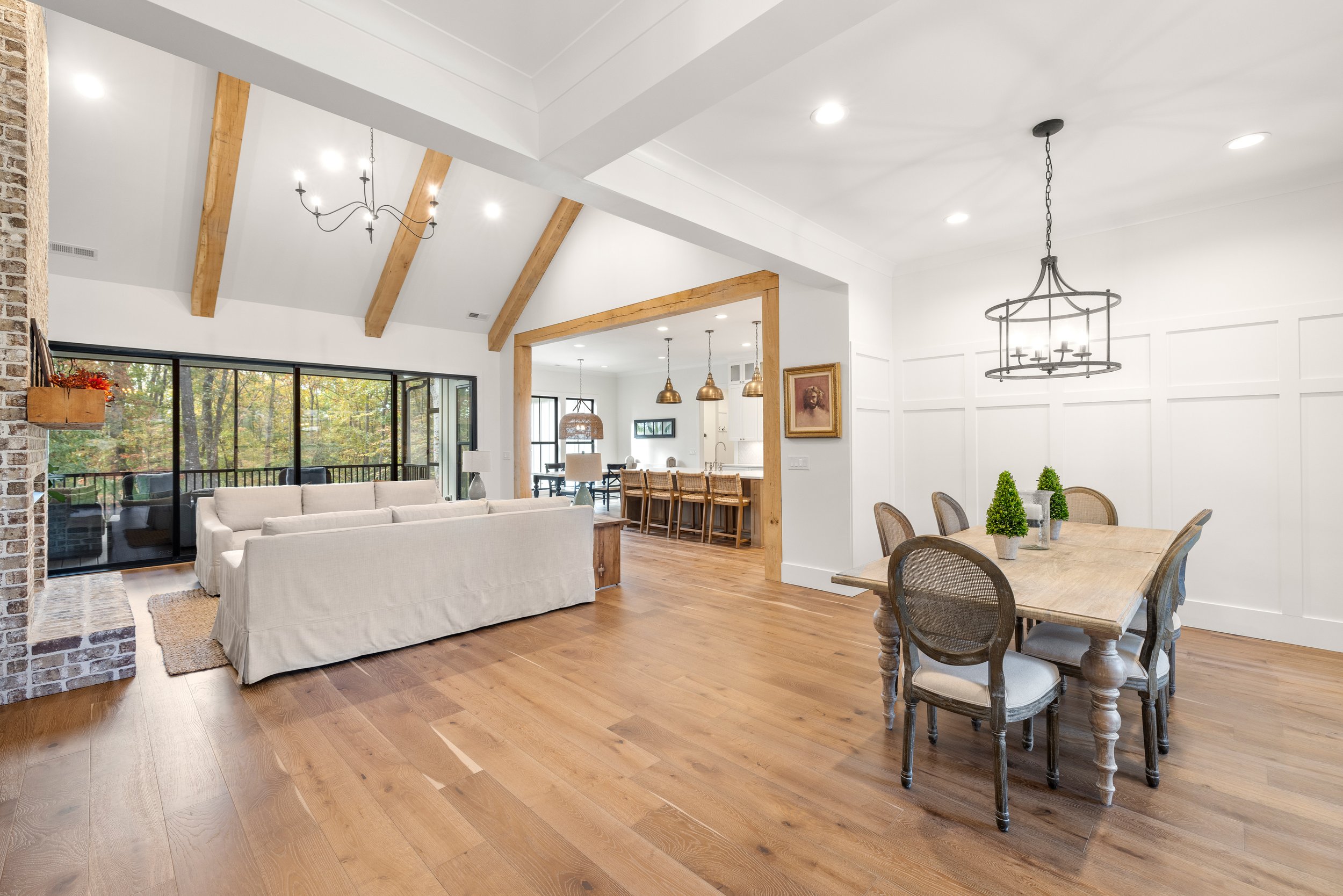 Wide plank engineered hardwood floors. 8x8 solid white oak decorative beams. Brick fireplace. 16'x8' Western sliding door.