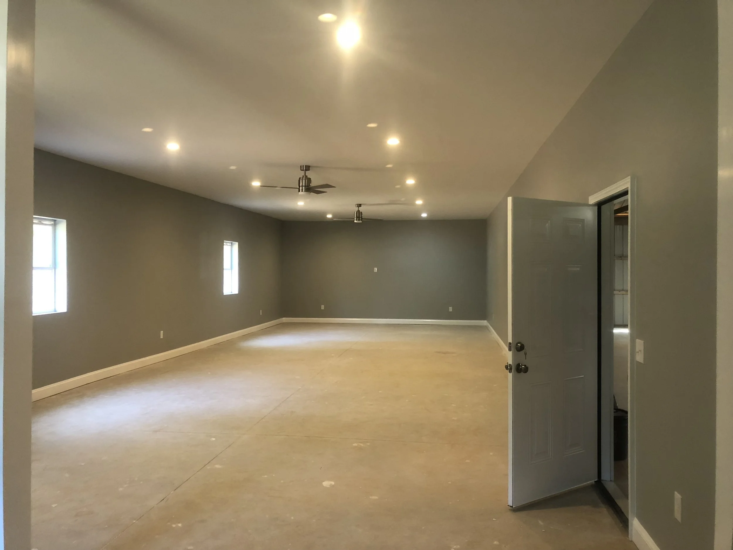 Interior of the finished game room/media room of a large pole barn.