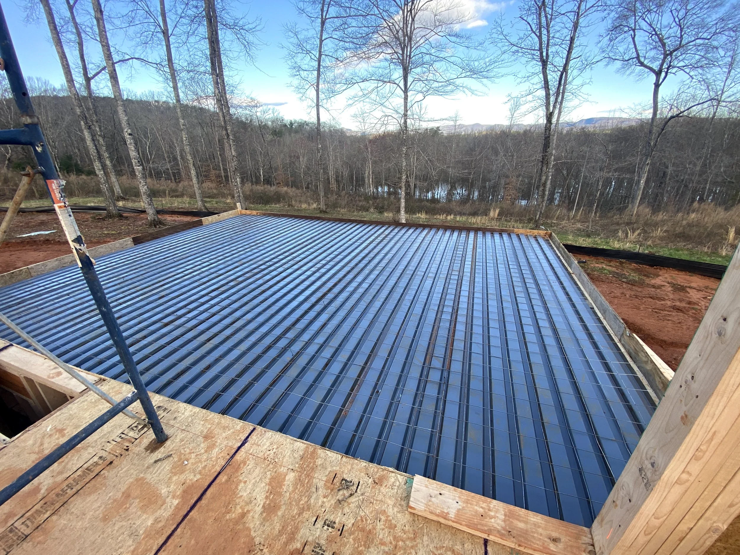Metal pan with wire mesh on top for the concrete back porch. Underneath concrete porch will be open, and access to the partial basement.