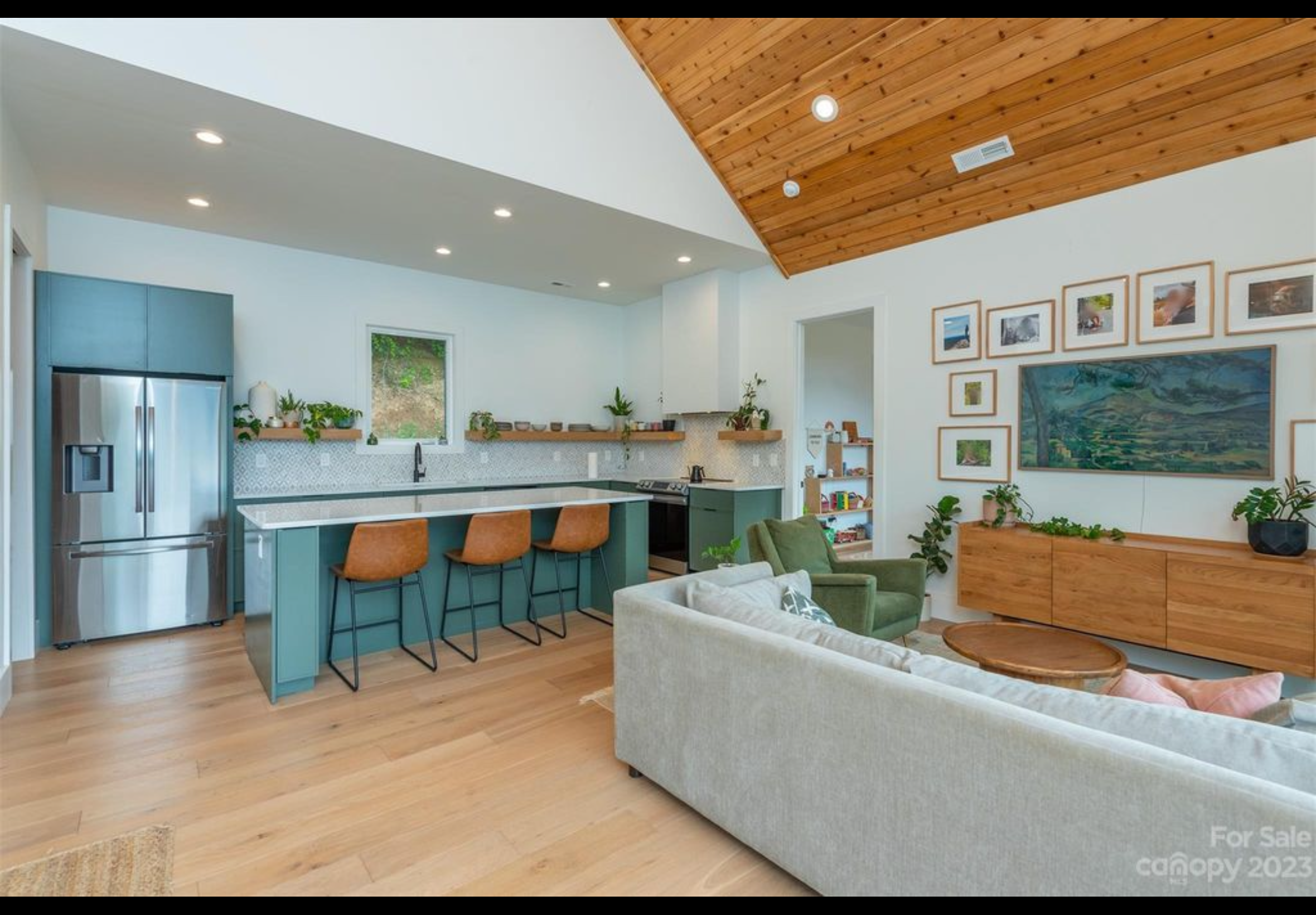 Finished interior of mountain getaway tiny home. Custom kitchen cabinets with Quartz counter tops. Cedar tongue and groove on vaulted ceiling.