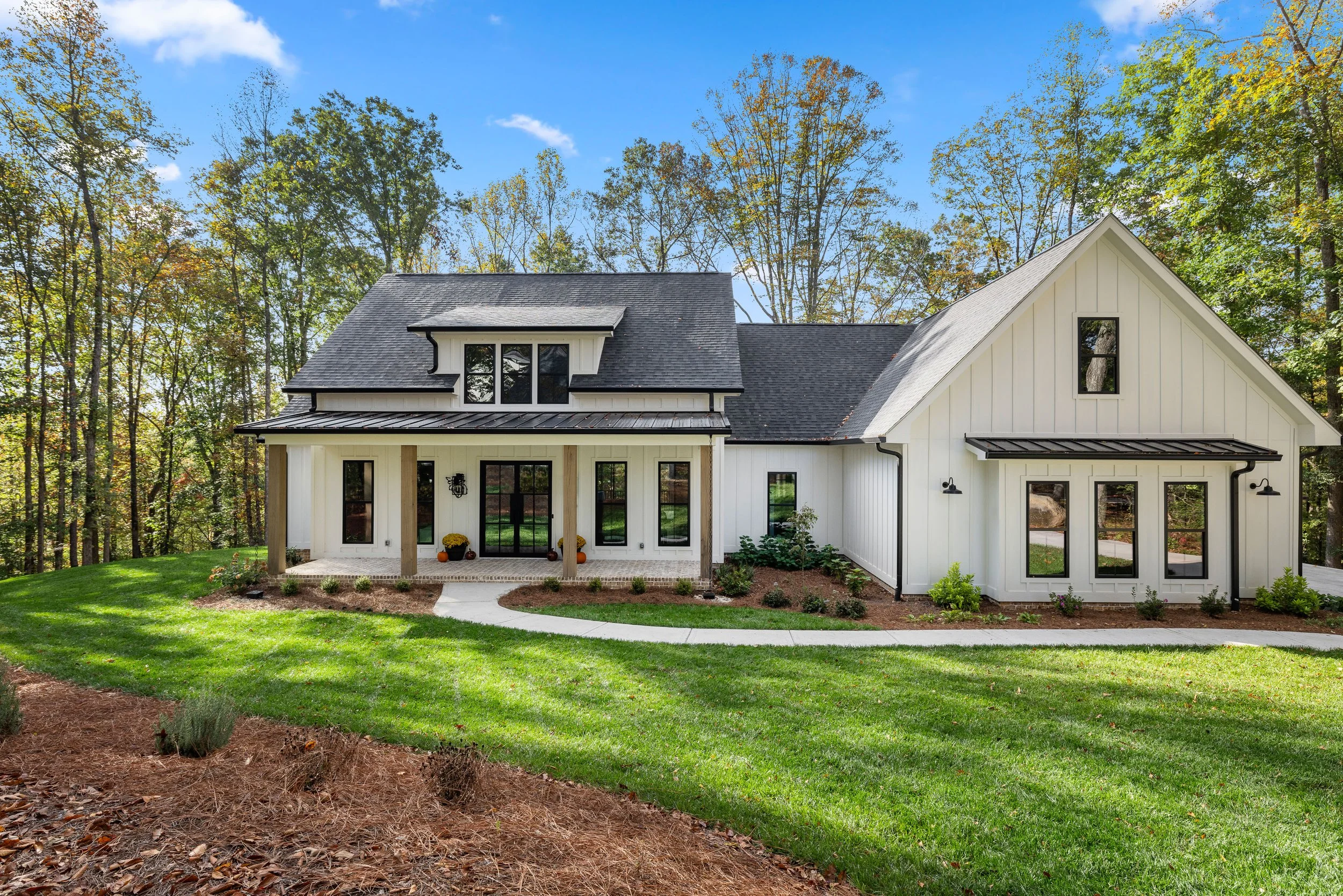 Fiber cement board and baton siding. Standing seam accent roofs. 