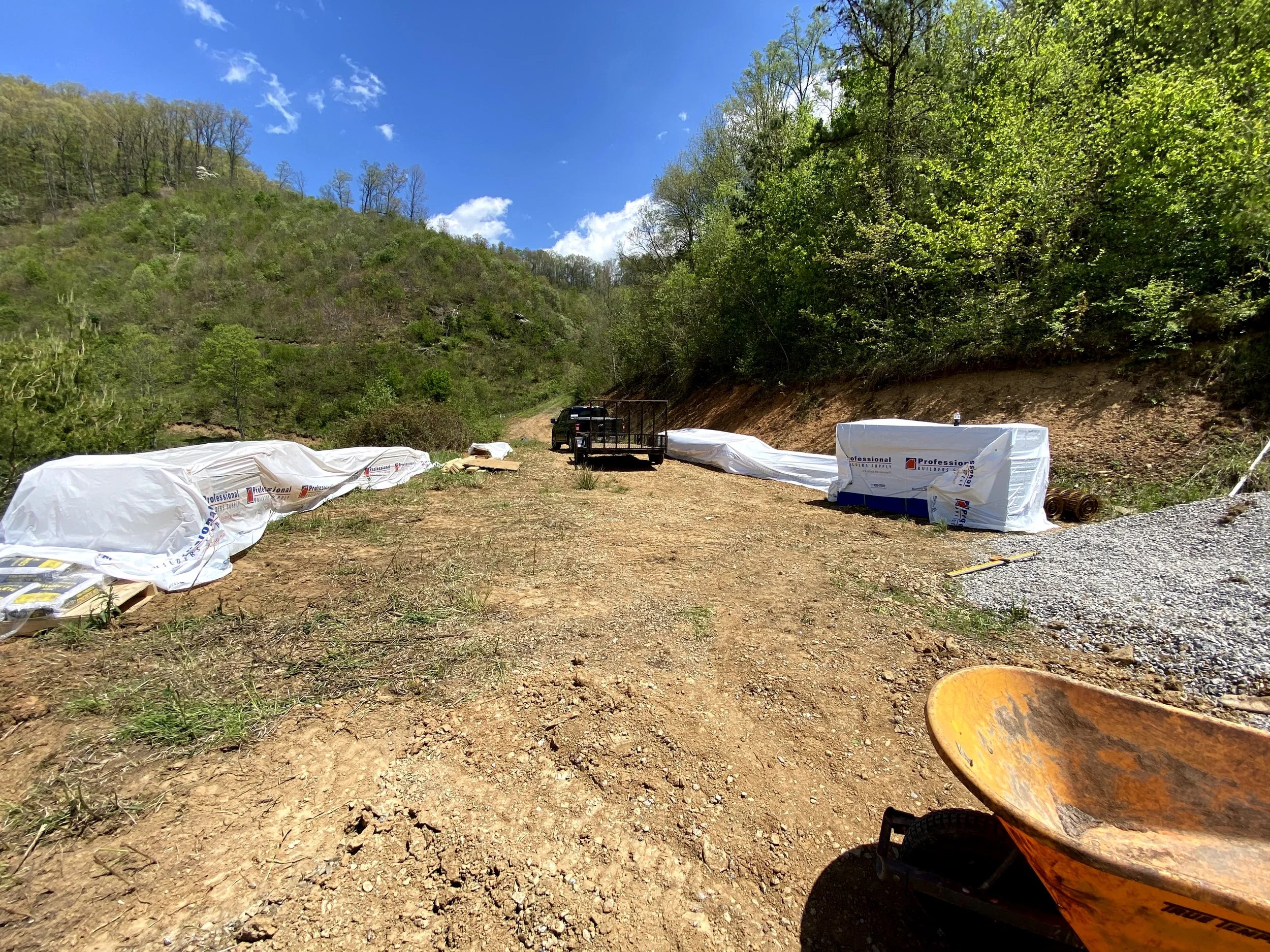 Framing materials prepped beside house site.