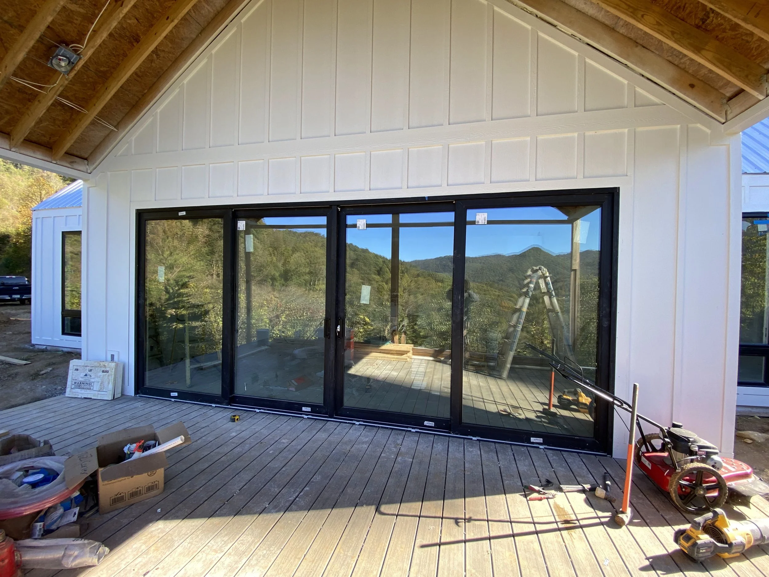 20'x8' PGT vinyl bi parting sliding doors. White interior and black exterior.