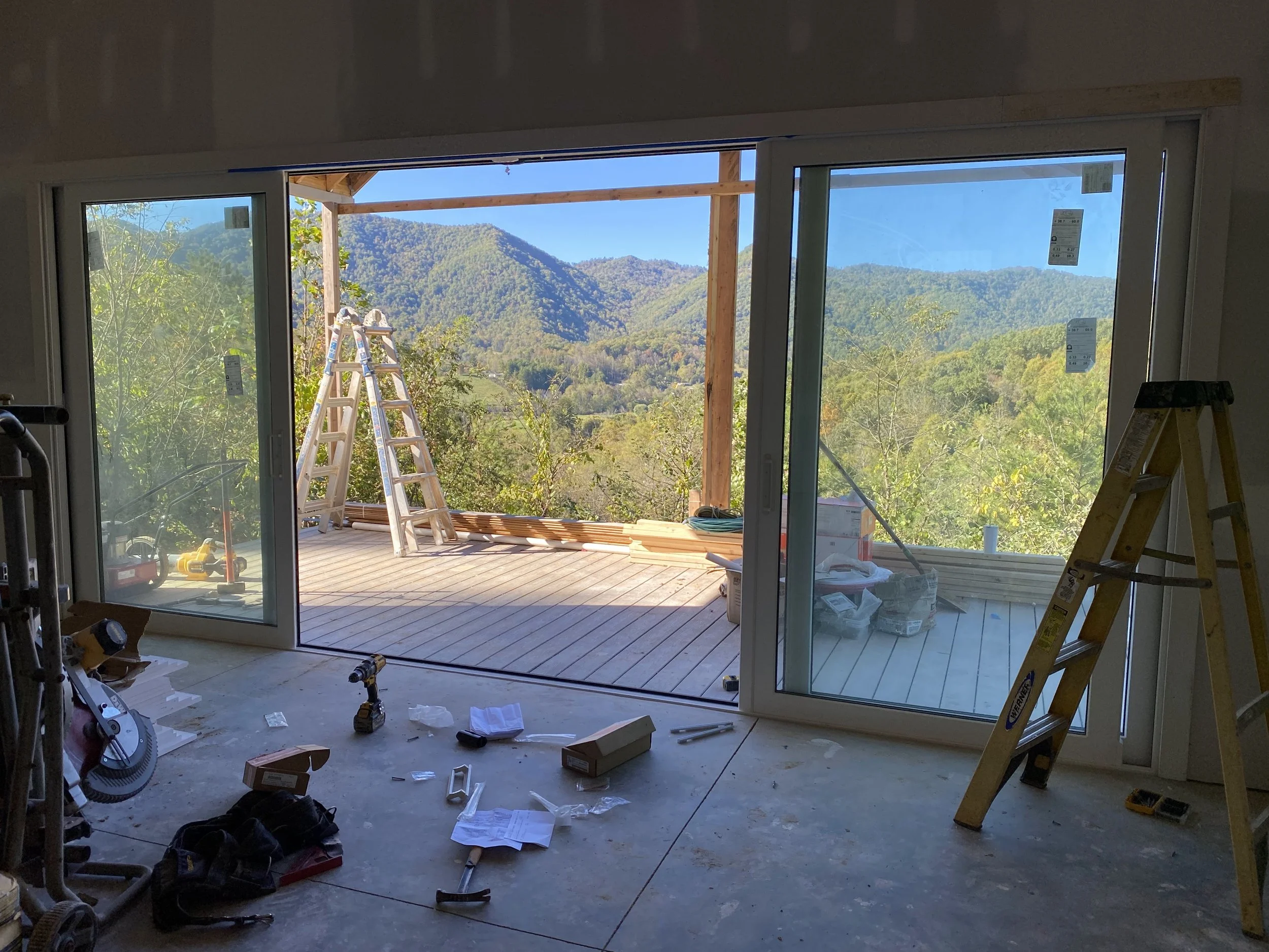 20'x8' PGT vinyl bi parting sliding doors. White interior and black exterior. 