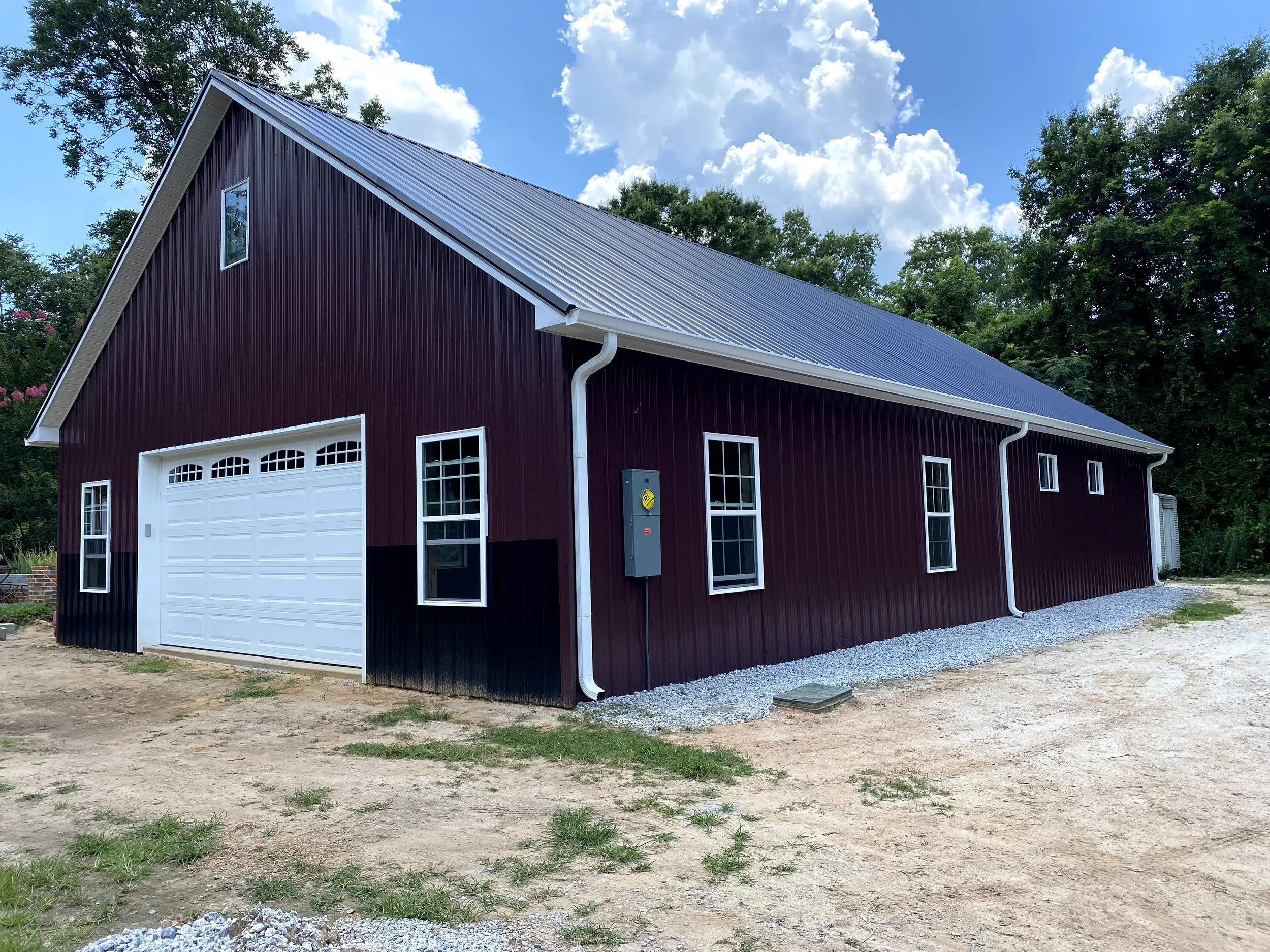Large pole barn with metal Tough Rib metal roofing and siding. Vinyl windows.