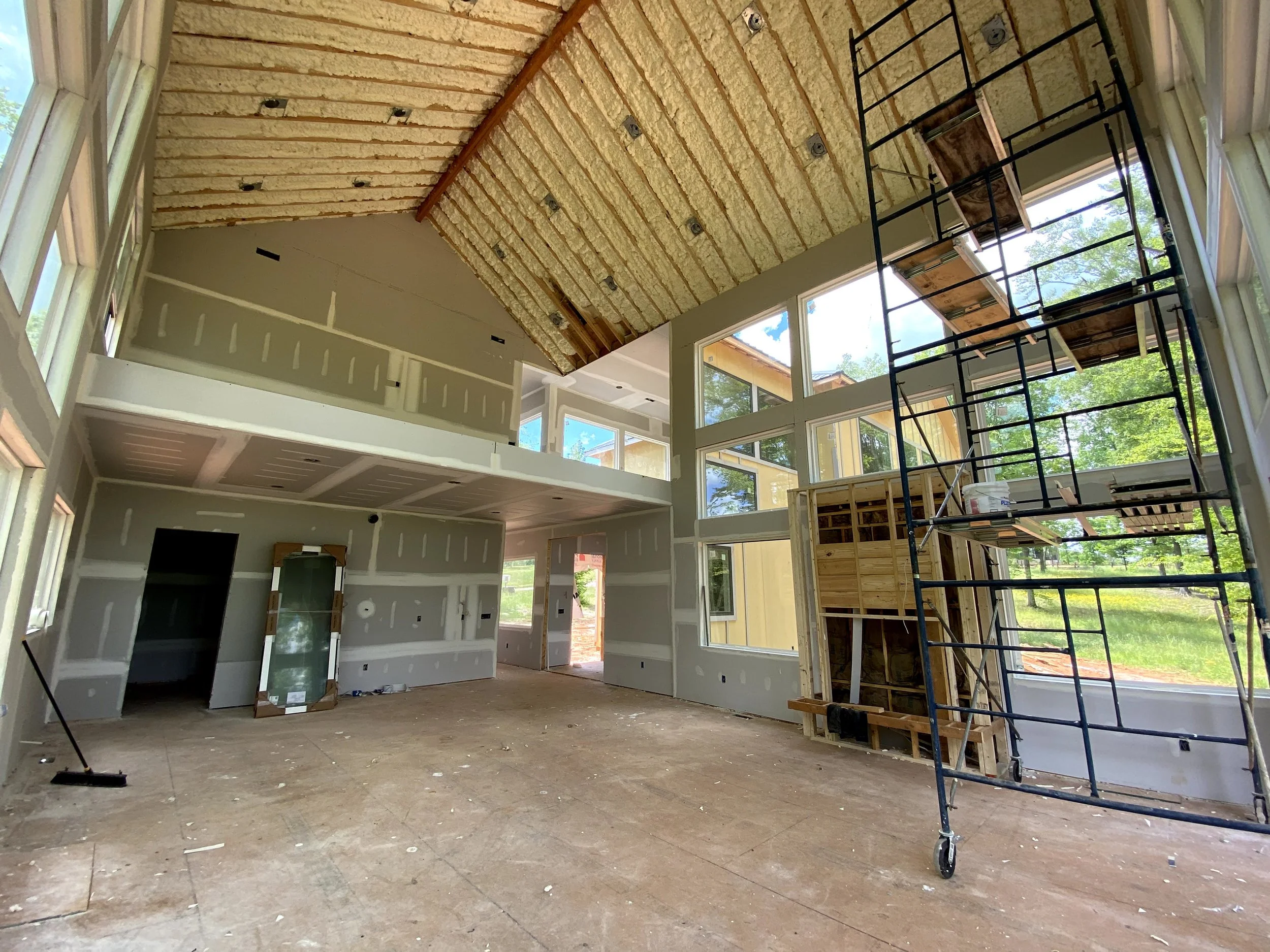 Spray foam insulation sprayed on all of roof deck. Sheetrock installed. Ventless fireplace installed.