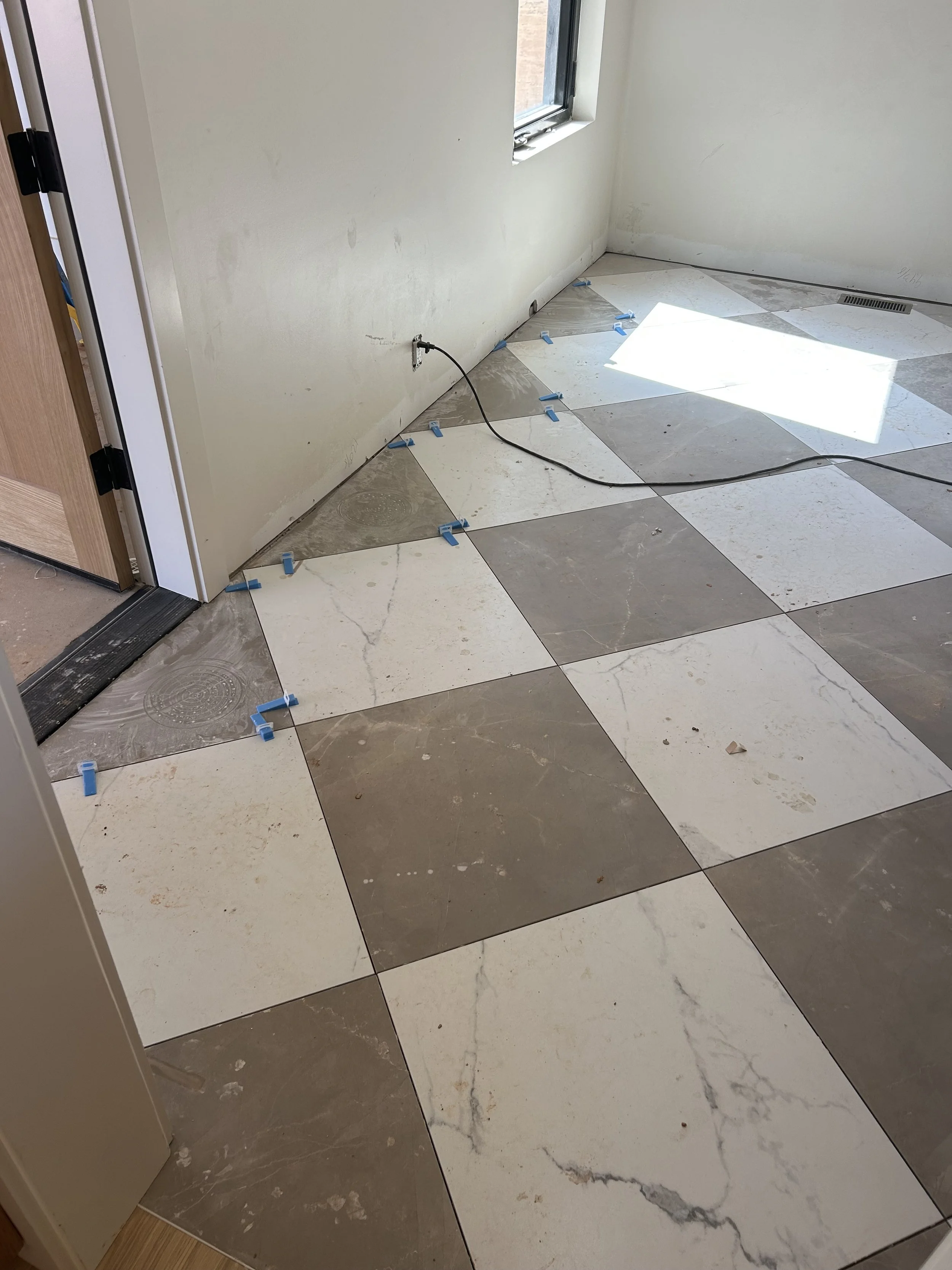 Mudroom tile coming in from the garage. no step up from garage to inside of home. 