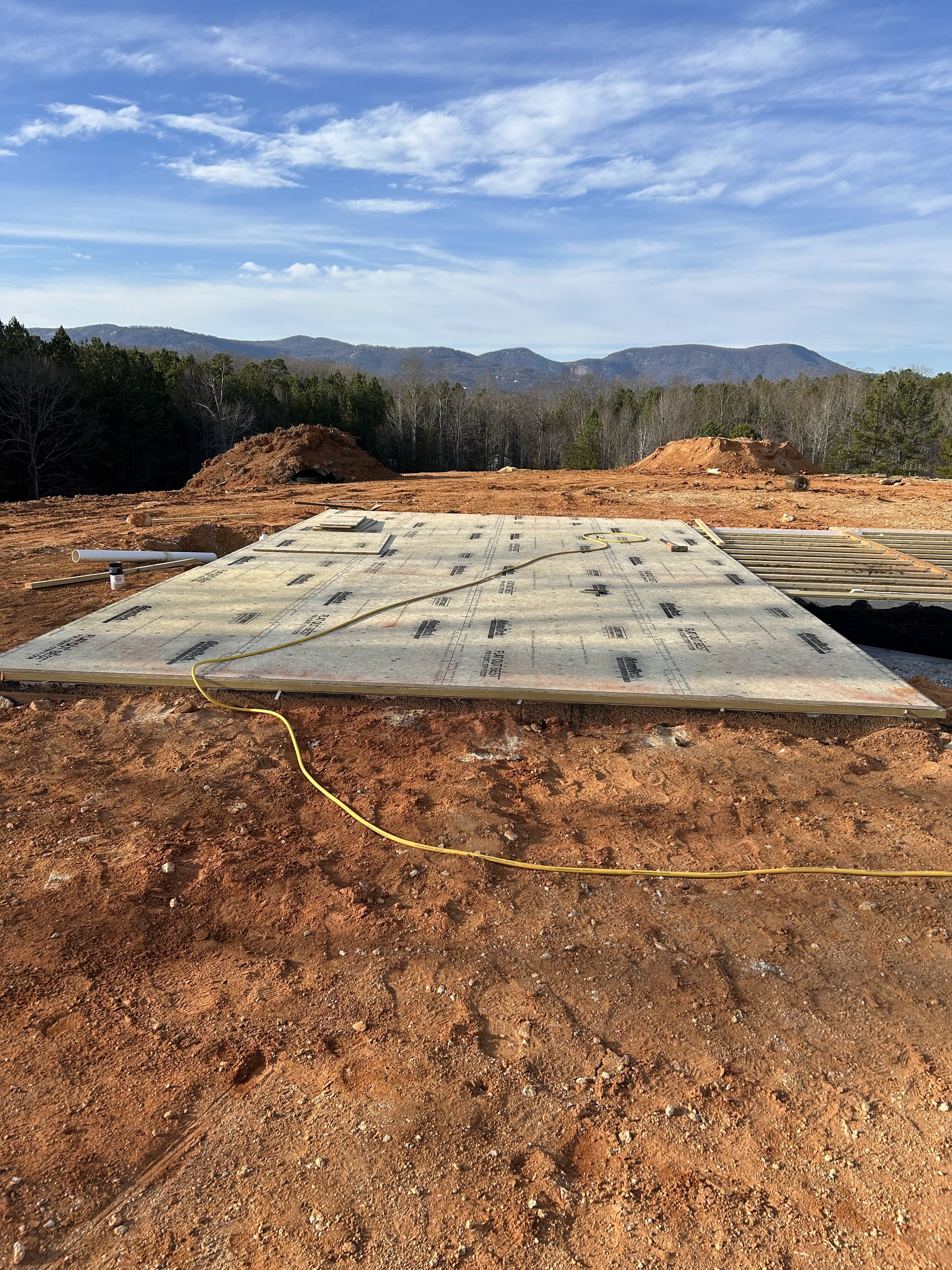 3/4" advantech subfloor is installed over TJI floor joists and pressure treated sill plates. Subfloor to sit tight against 2" rigid foam boards and spray foam in crawlspace to create encapsulation.