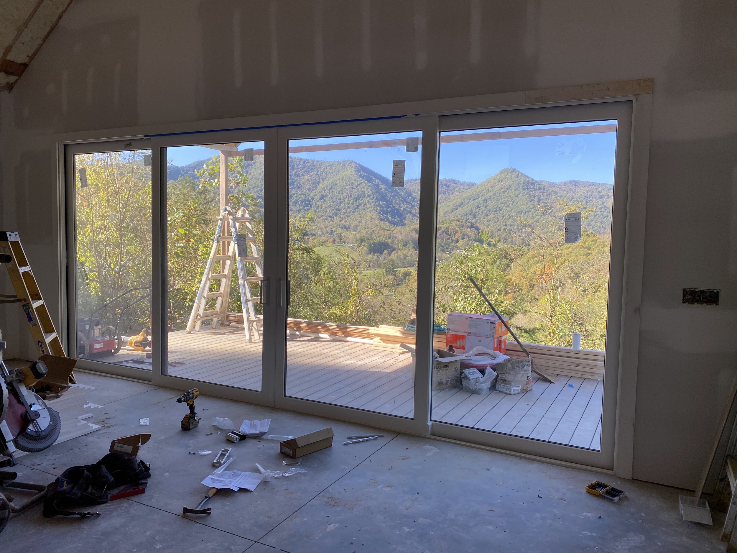 20'x8' PGT vinyl bi parting sliding doors. White interior and black exterior.