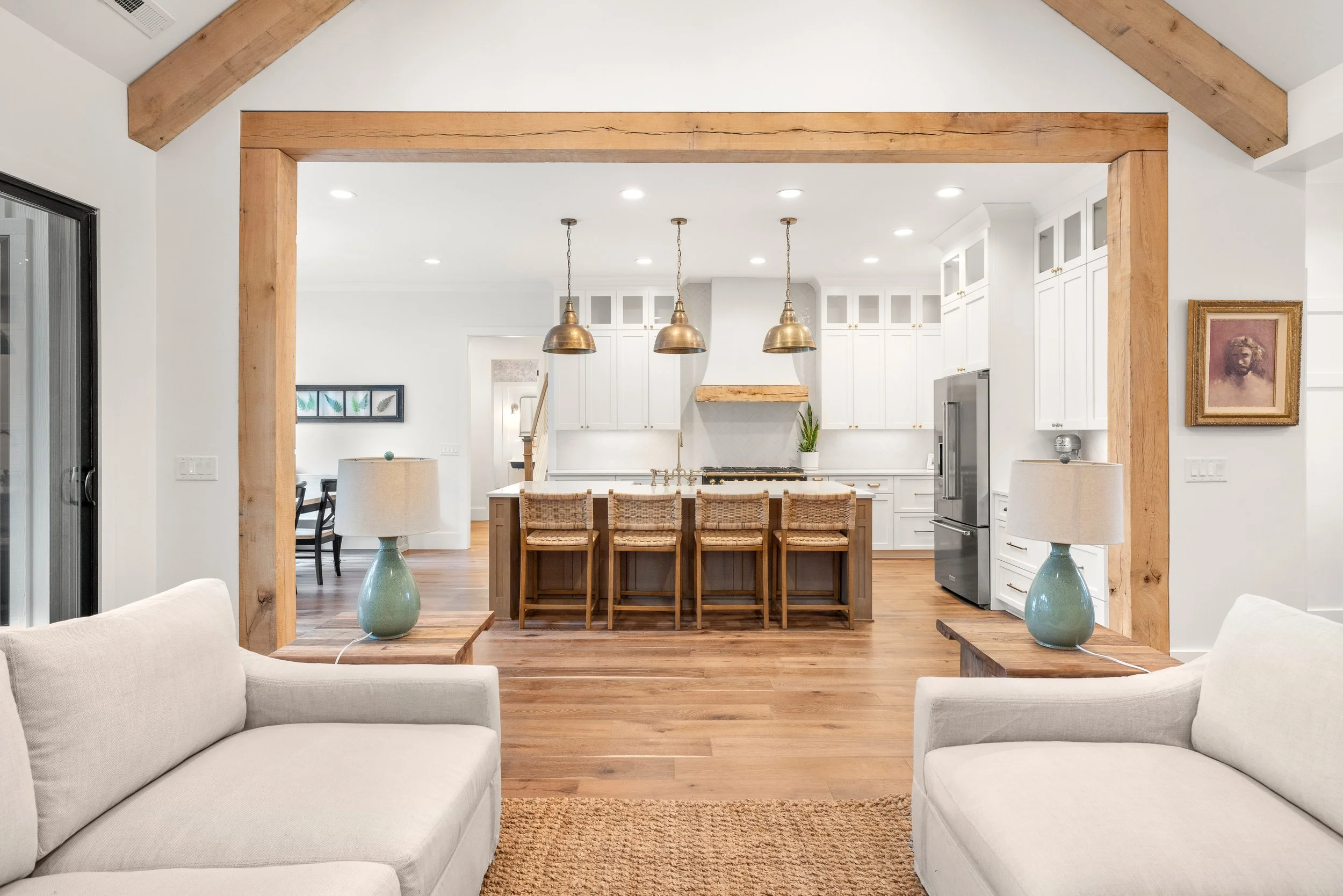 Wide plank engineered hardwood floors. 8x8 solid white oak decorative beams. Brick fireplace. Custom cabinetry.
