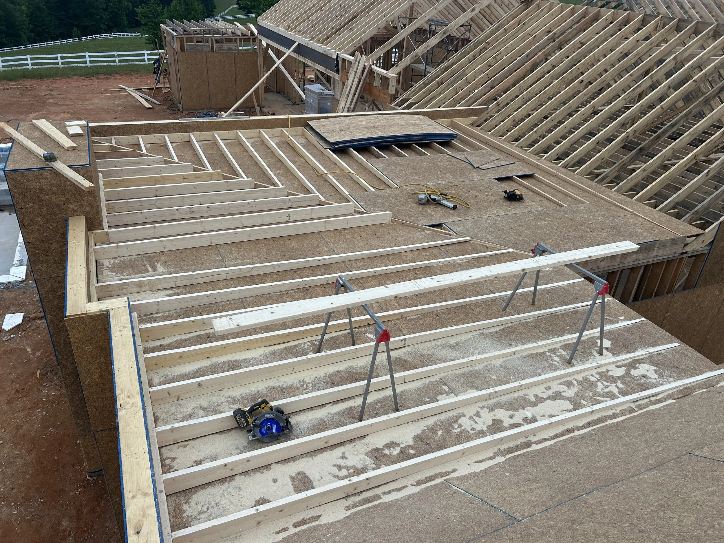 .25/12 roof pitch, also known as a flat roof, built over primary suite.