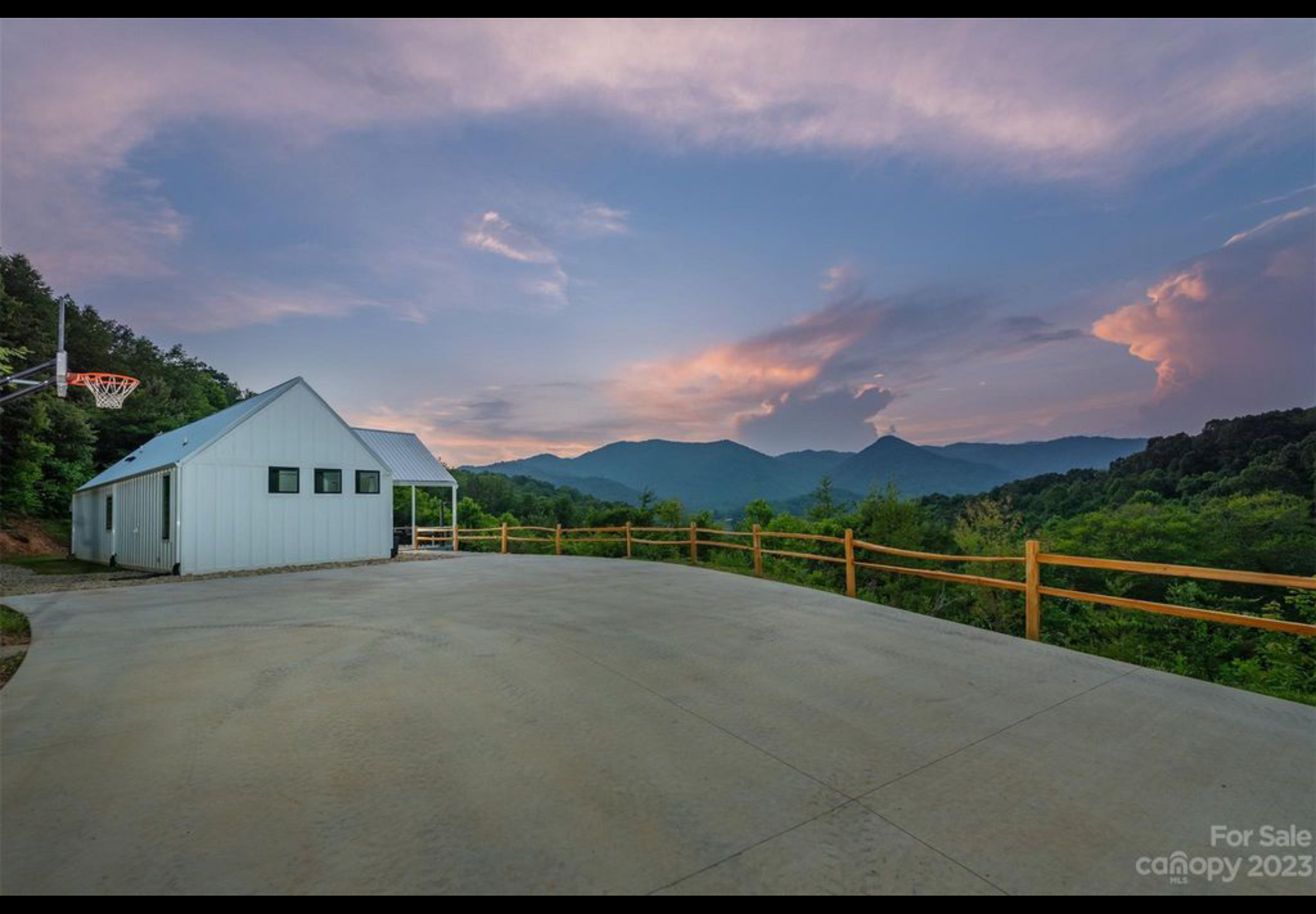 Finished house and driveway. Cedar split rail fence. Fiber cement board and baton siding. Galvanized Tough Rib metal roofing.