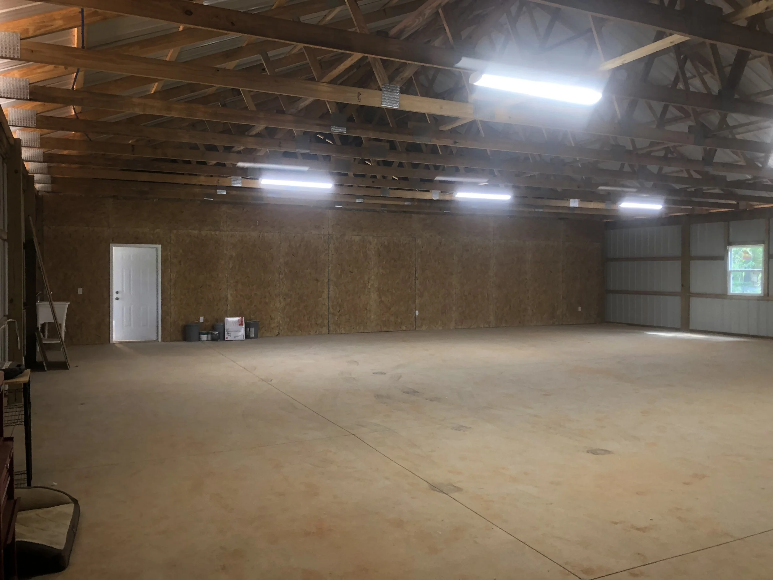 Interior of the shop portion of a large pole barn.