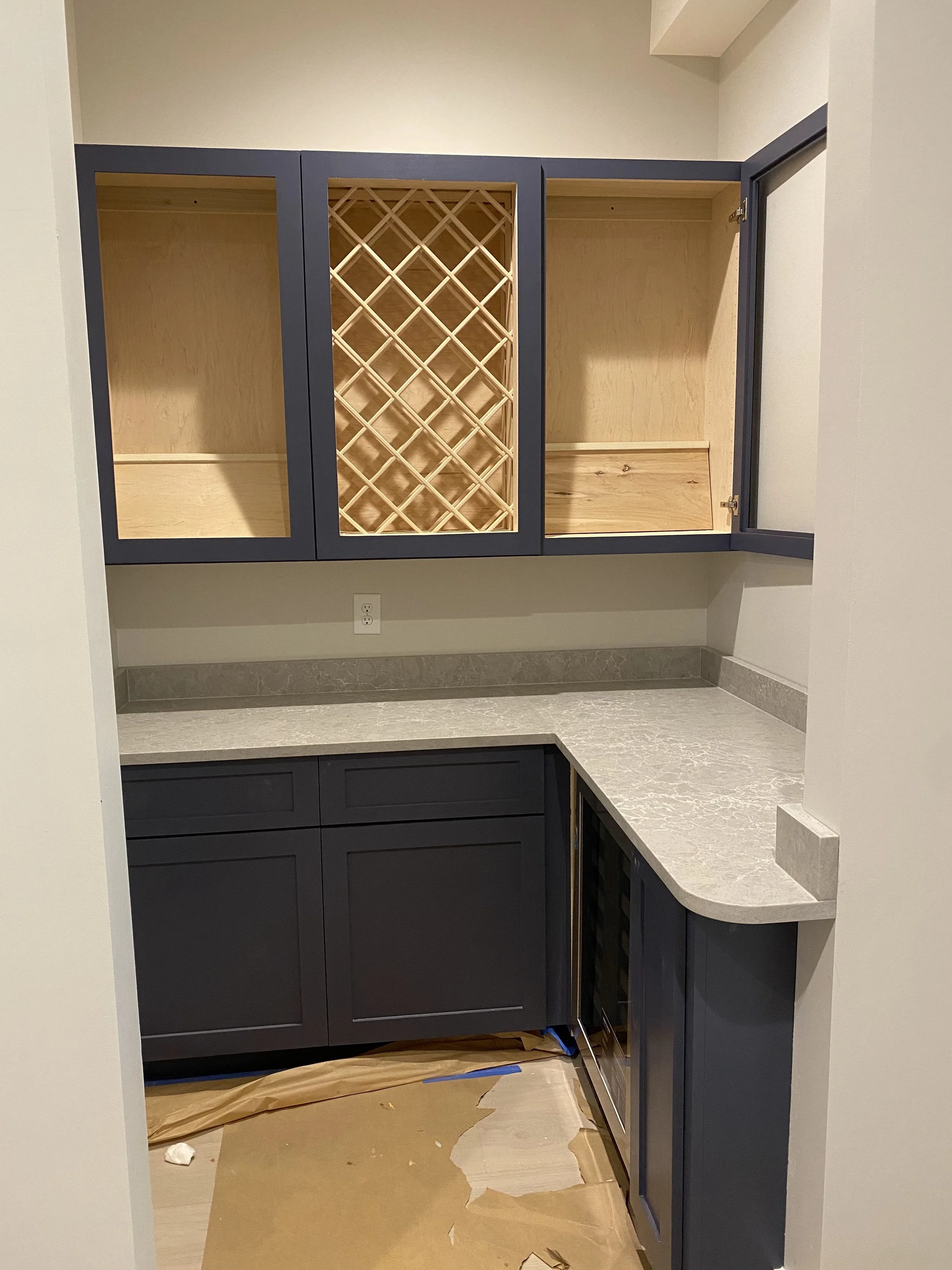 Custom cabinetry in large walk in pantry with Quartz counter tops.